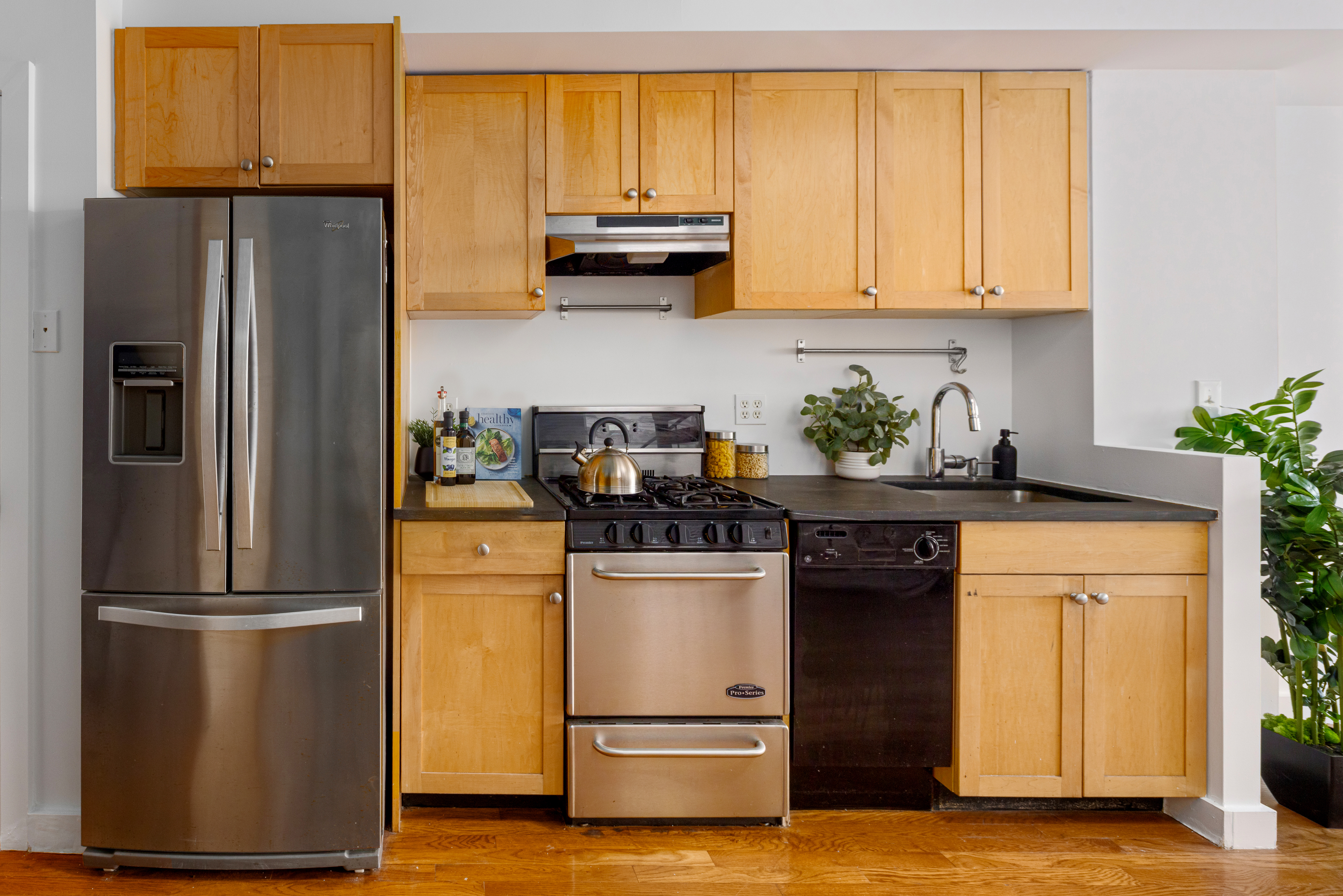 569 Carroll Street, Unit 9 Brooklyn, NY 11215 - Photo 3 of 15 a kitchen with a refrigerator and a stove