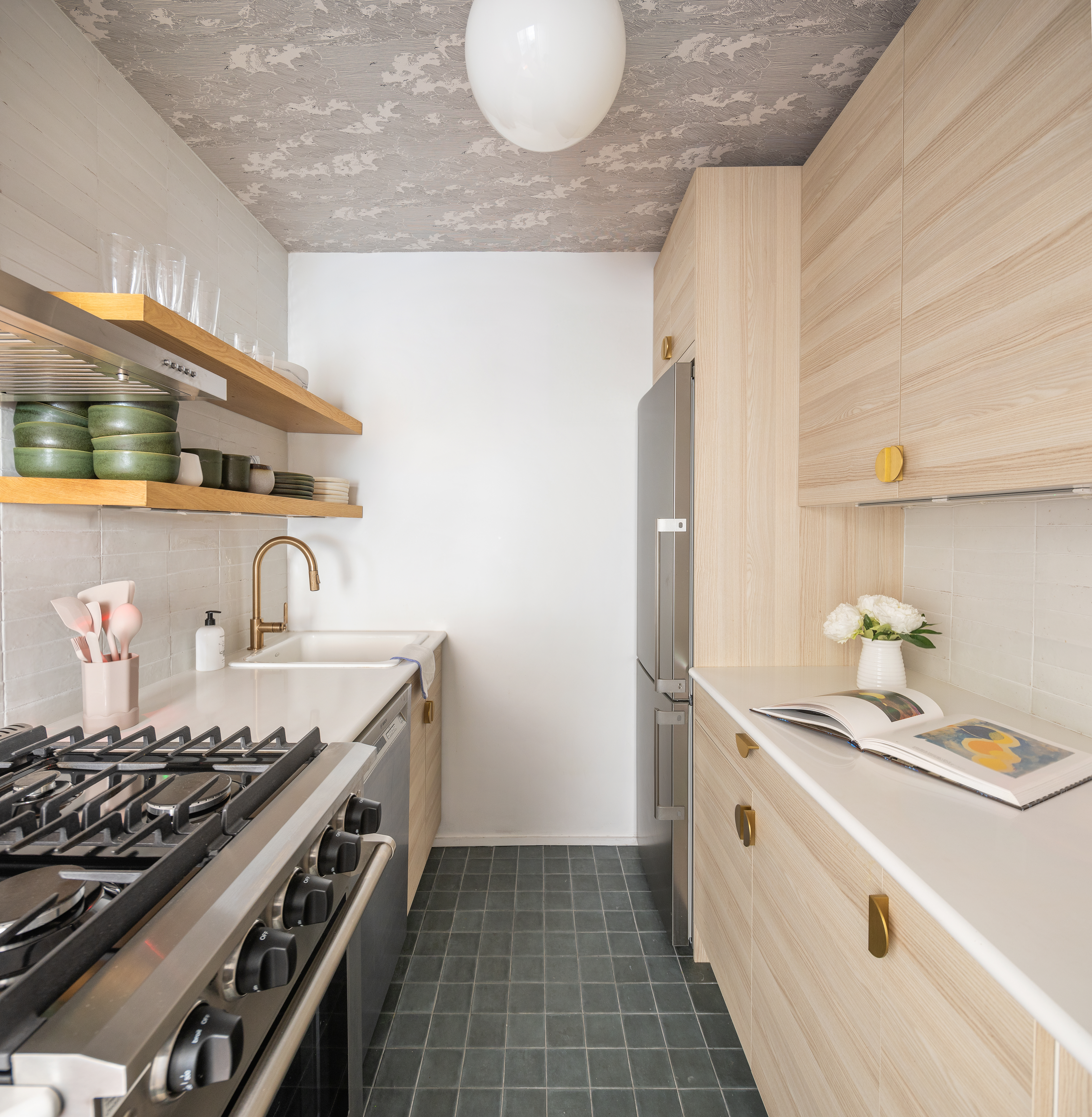 14 Horatio Street, Unit 11F Manhattan, NY 10014 - Photo 4 of 16 a kitchen with granite countertop a sink stove and cabinets