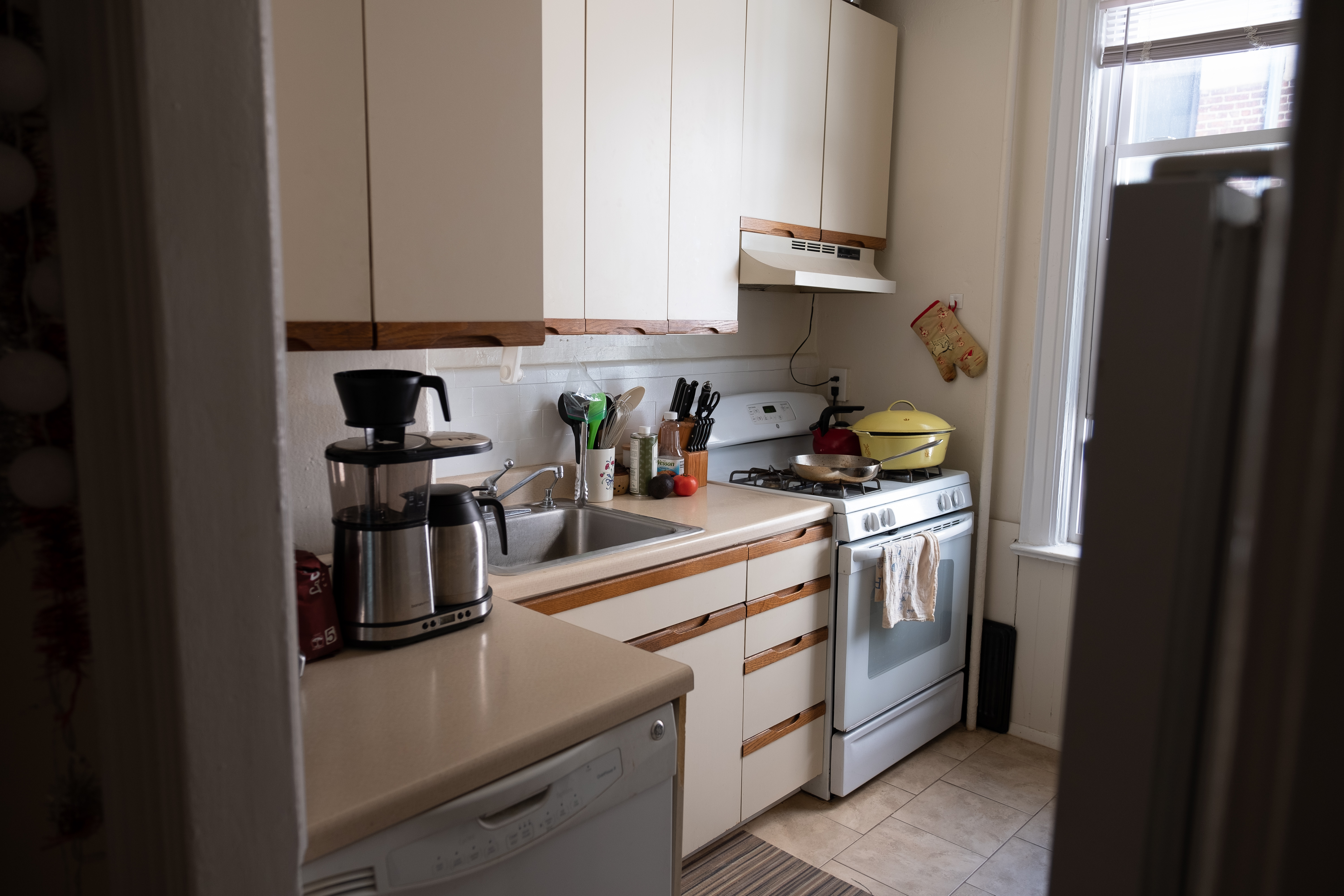 31-74 33rd Street, Unit 1R Queens, NY 11106 - Photo 5 of 5 a kitchen with stainless steel appliances granite countertop a refrigerator and a stove