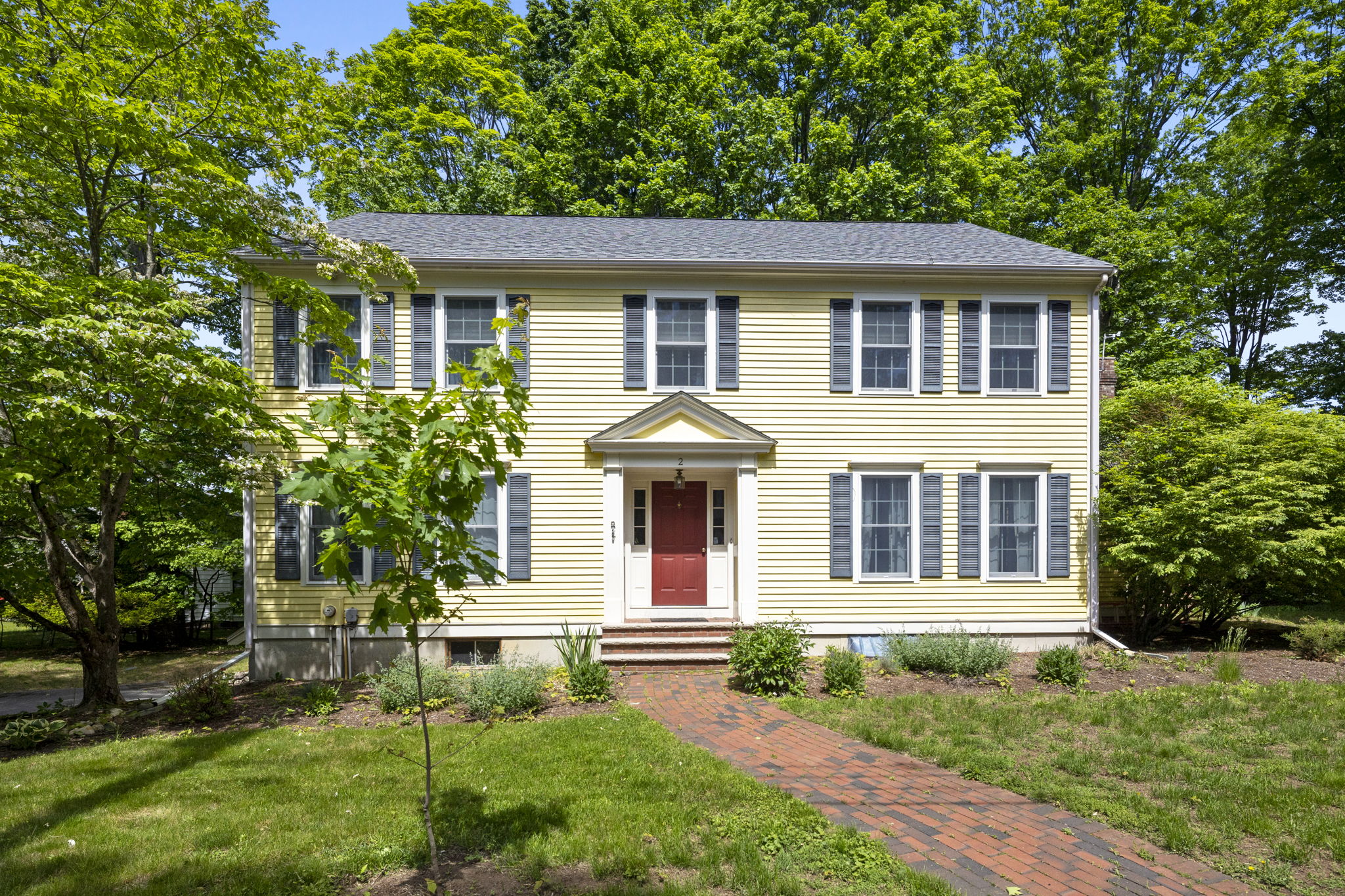 front view of a house with a yard