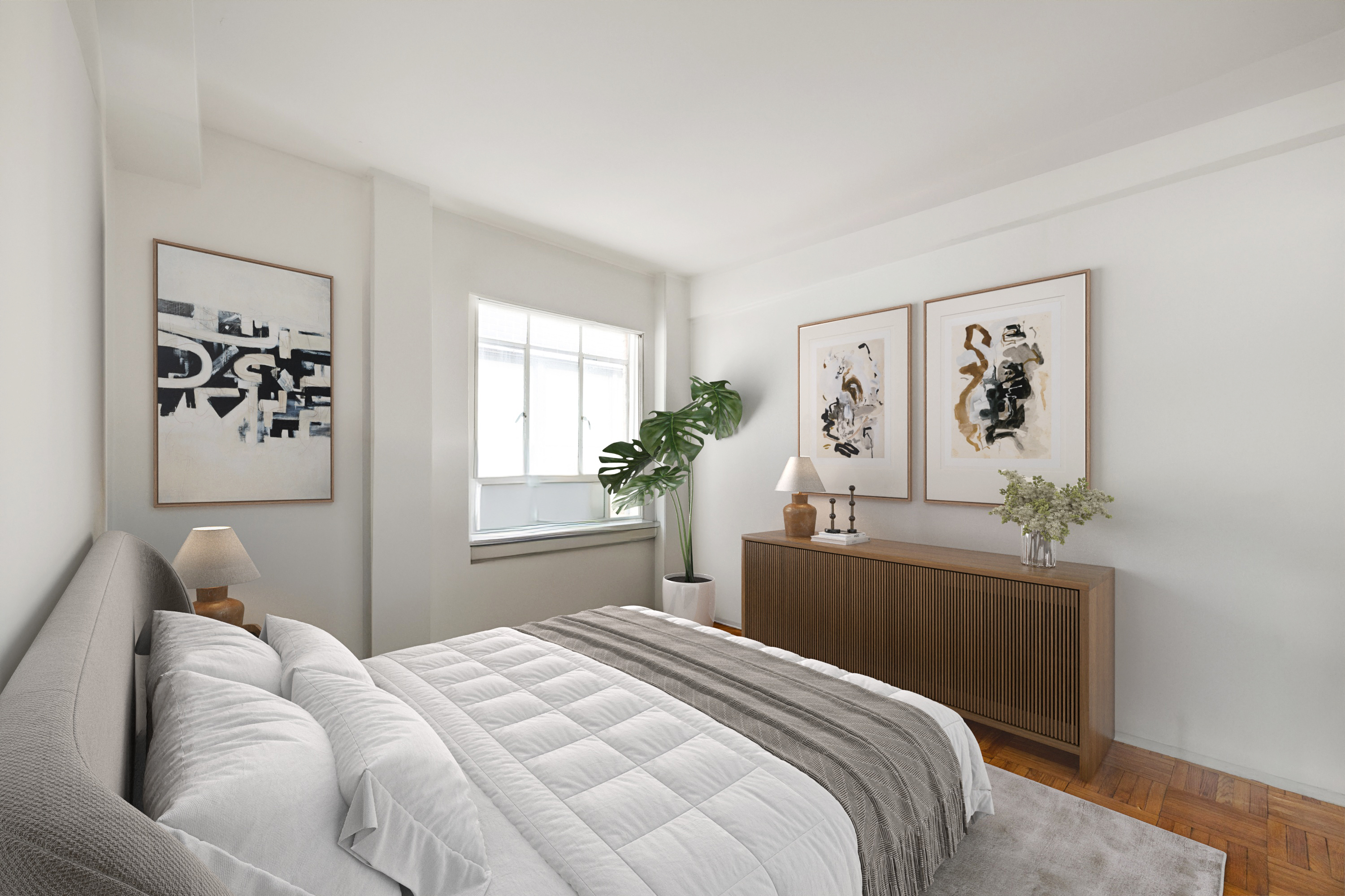 45 West 54th Street, Unit 9E Manhattan, NY 10019 - Photo 6 of 9 a bedroom with a large bed and a couch