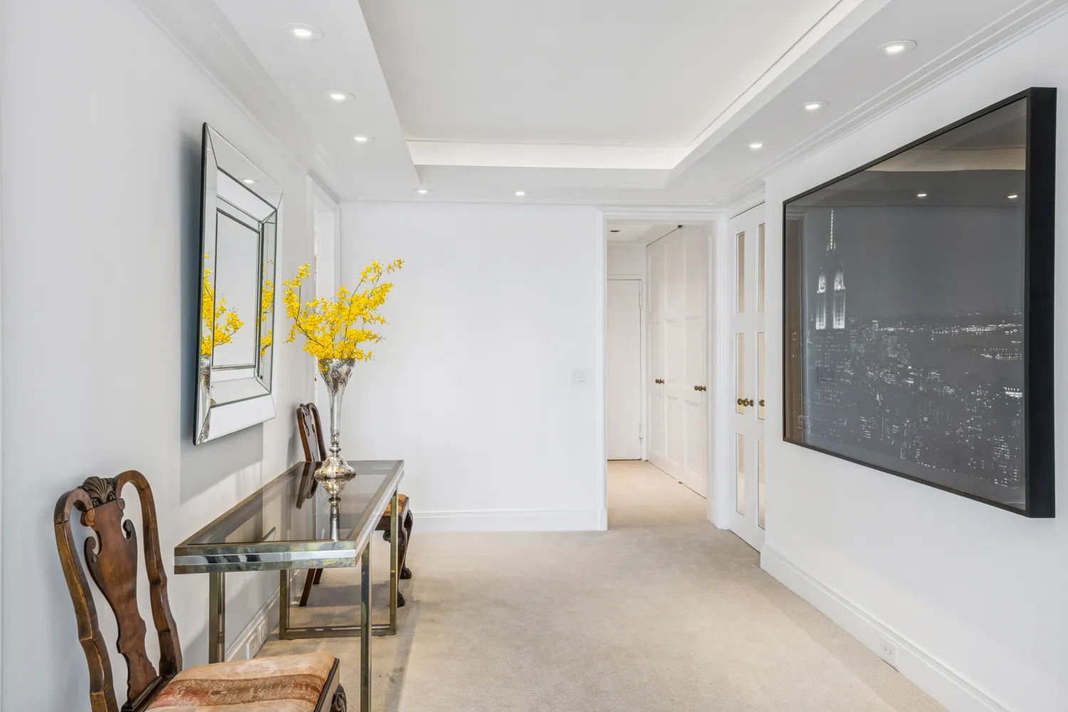 a view of a dining room with furniture and a potted plant