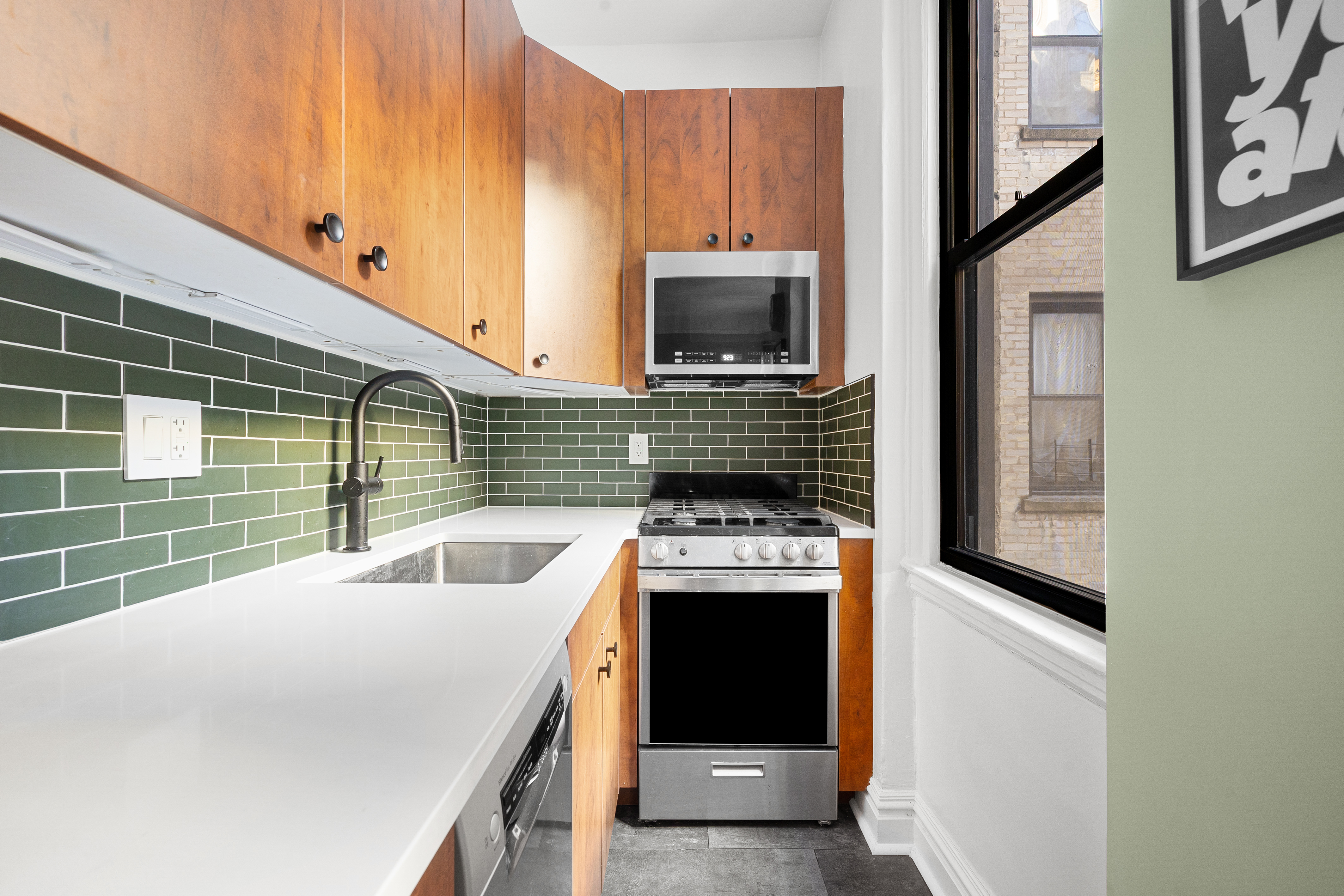 78 8th Avenue, Unit 2K Brooklyn, NY 11215 - Photo 5 of 10 a kitchen with stainless steel appliances a sink a stove and a refrigerator