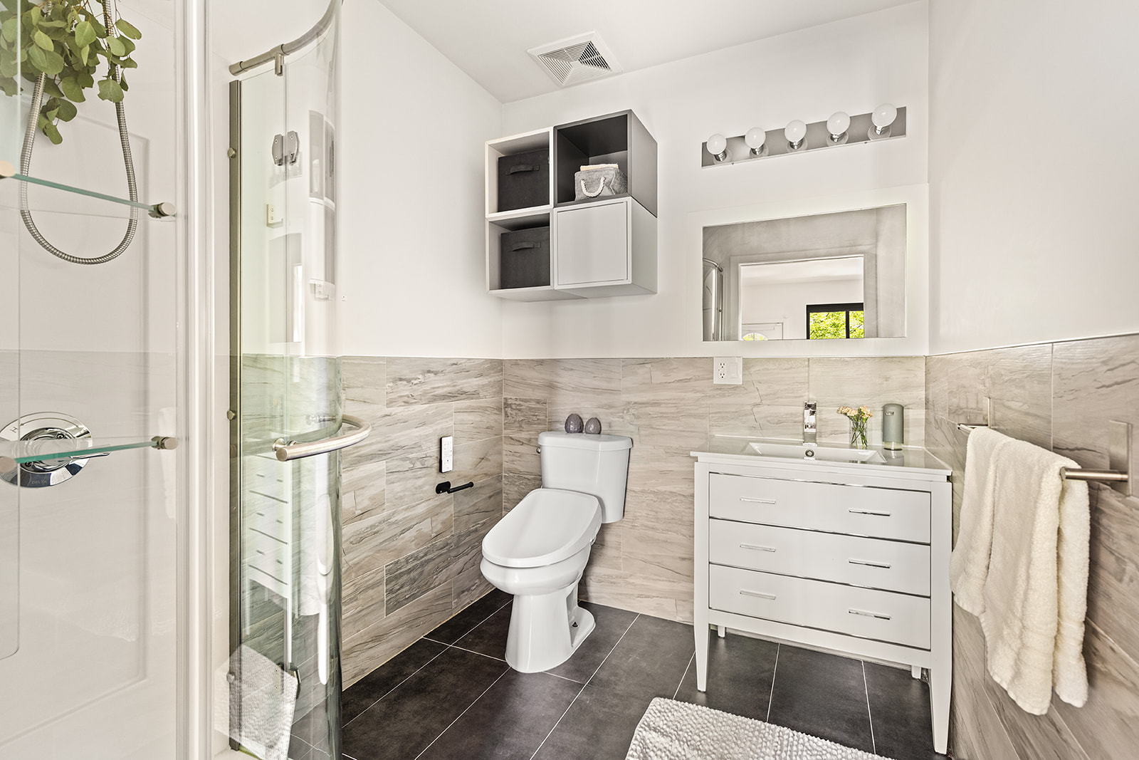495 Rutland Road, Unit 1 Brooklyn, NY 11203 - Photo 8 of 13 a bathroom with a granite countertop toilet sink and mirror
