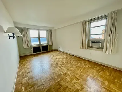 a view of an empty room with a window