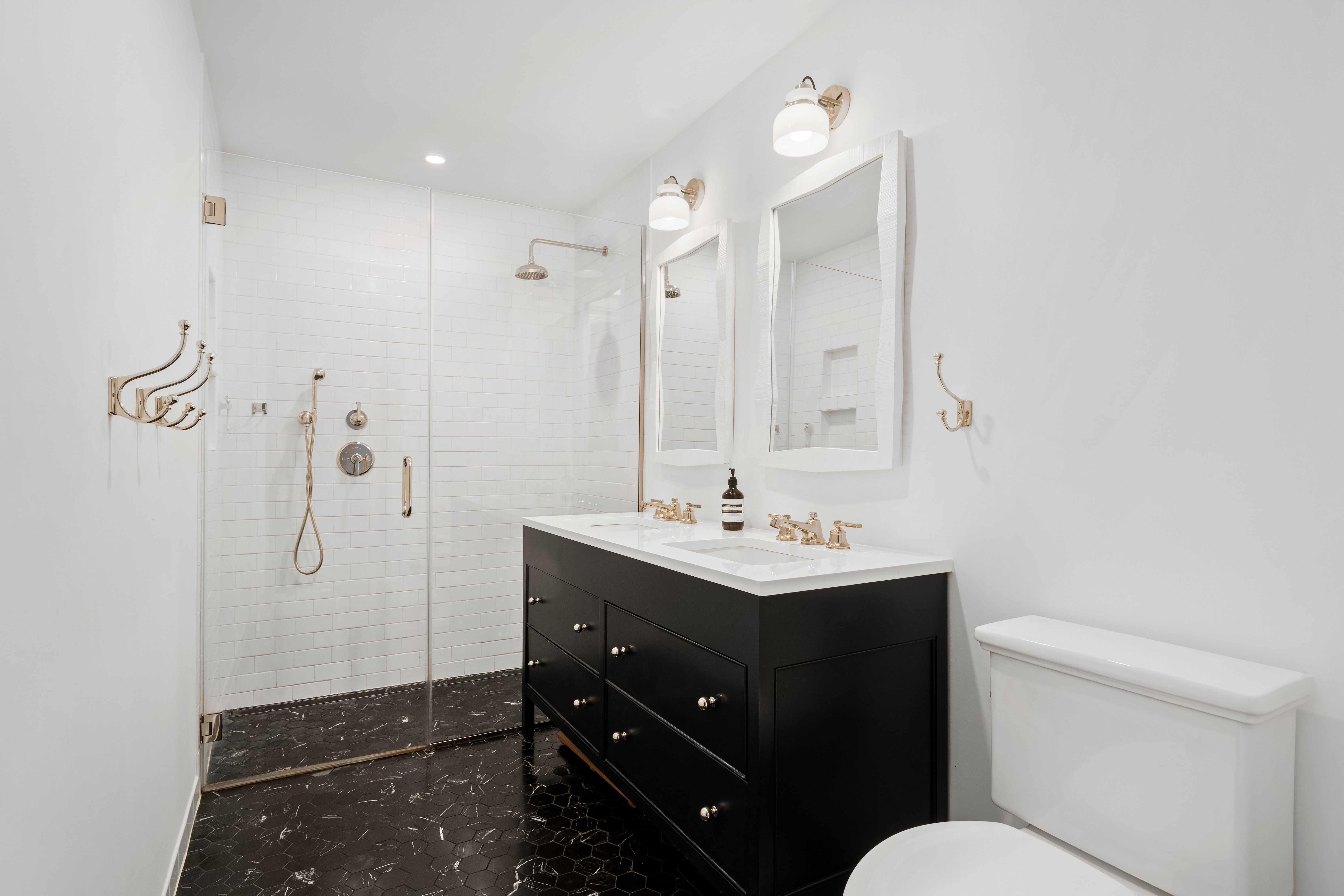 488 Sterling Place, Unit 4A Brooklyn, NY 11238 - Photo 6 of 13 a bathroom with a sink vanity mirror and toilet