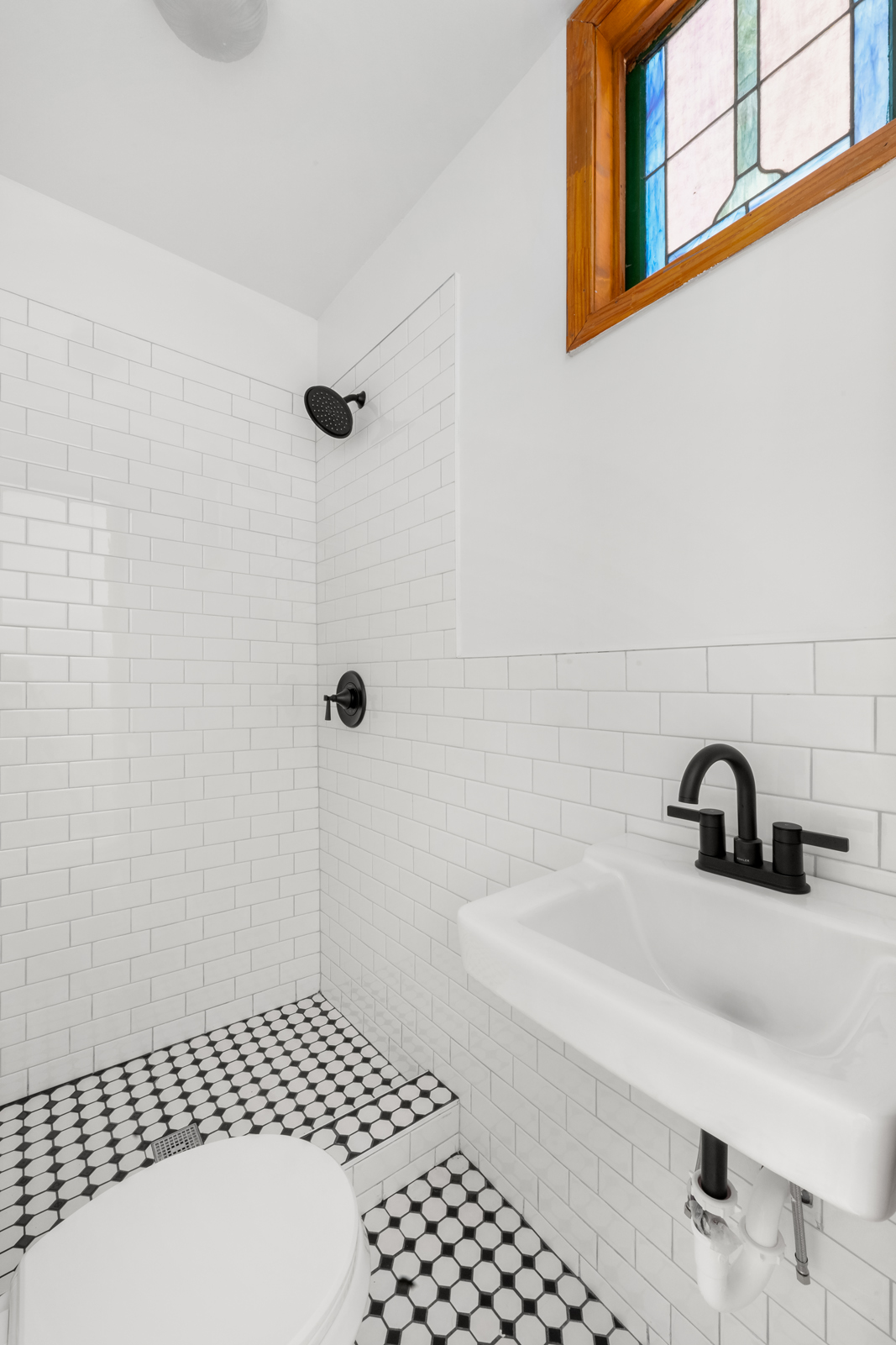 441 Union Street, Unit 2 Brooklyn, NY 11231 - Photo 5 of 11 a bathroom with a sink a toilet and shower