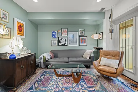 a living room with furniture and a rug