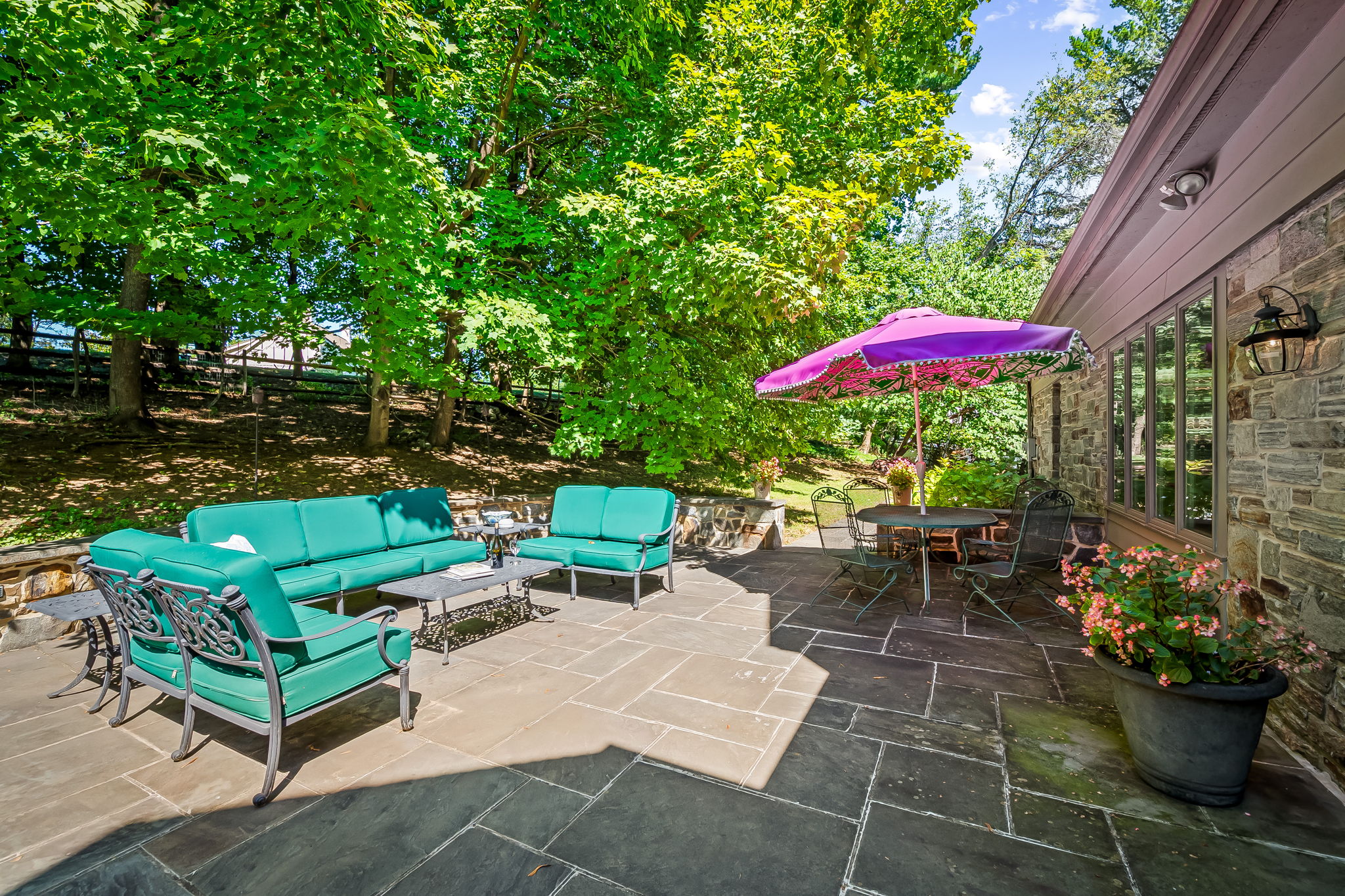 910 Army Road Towson, MD 21204 - Photo 21 of 62 an outdoor sitting area with furniture and umbrella