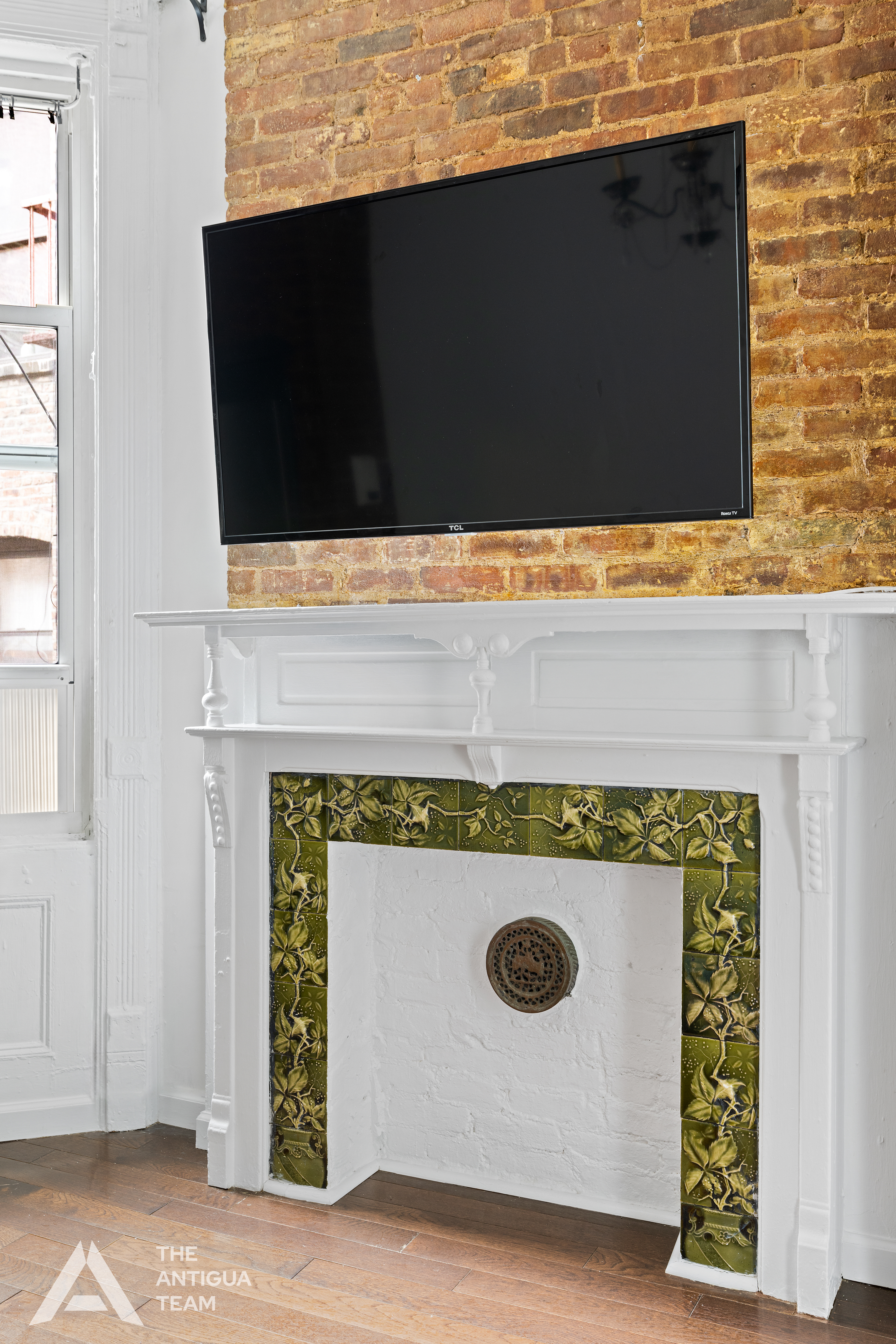 264 West 22nd Street, Unit 5 Manhattan, NY 10011 - Photo 5 of 7 a stove top oven sitting inside of a kitchen