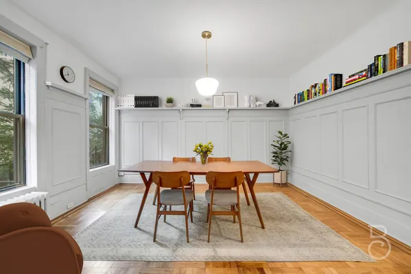 a view of a dining room with furniture window and wooden floor