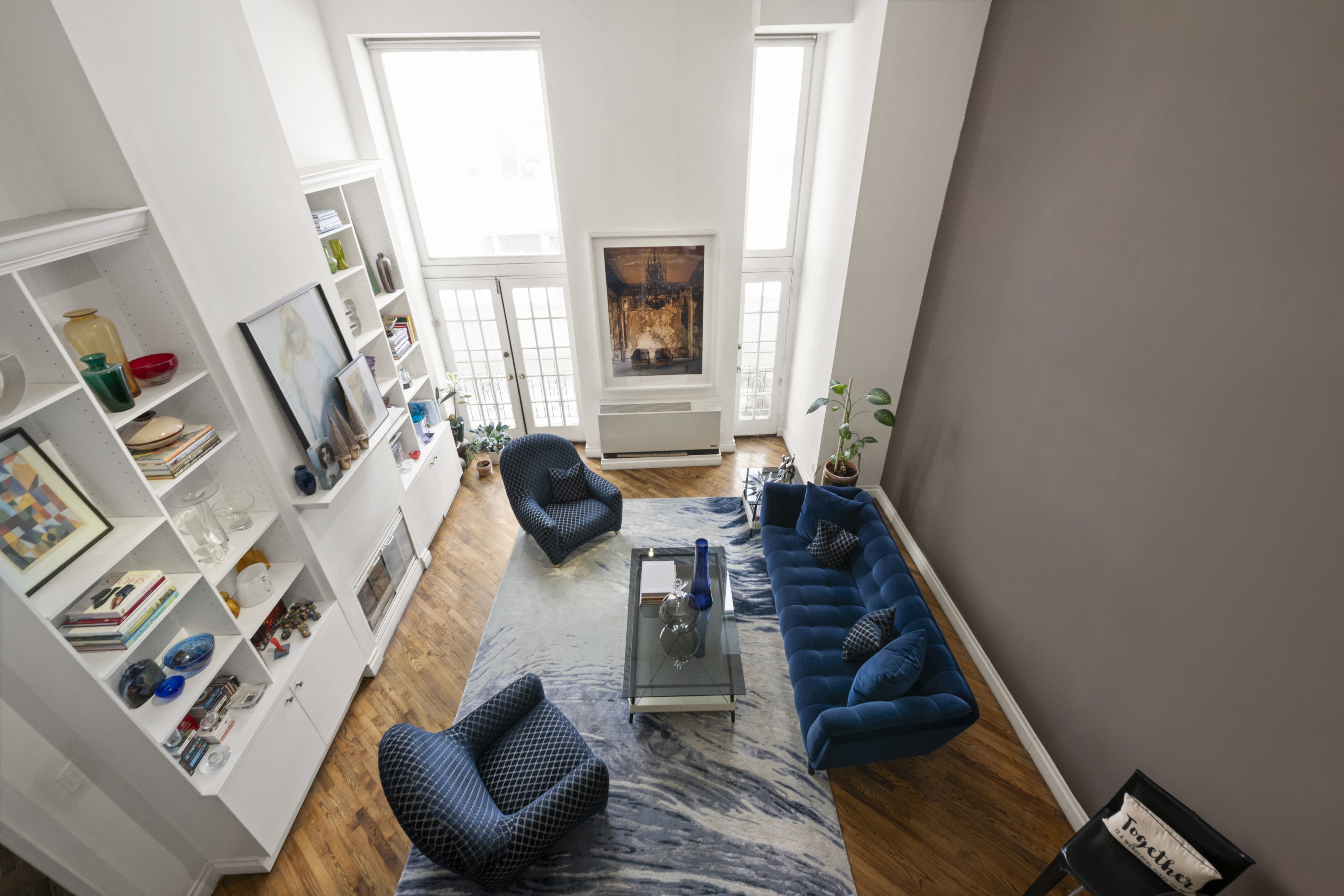 121 West 20th Street, Unit 2D Manhattan, NY 10011 - Photo 7 of 12 a living room with furniture and a fireplace