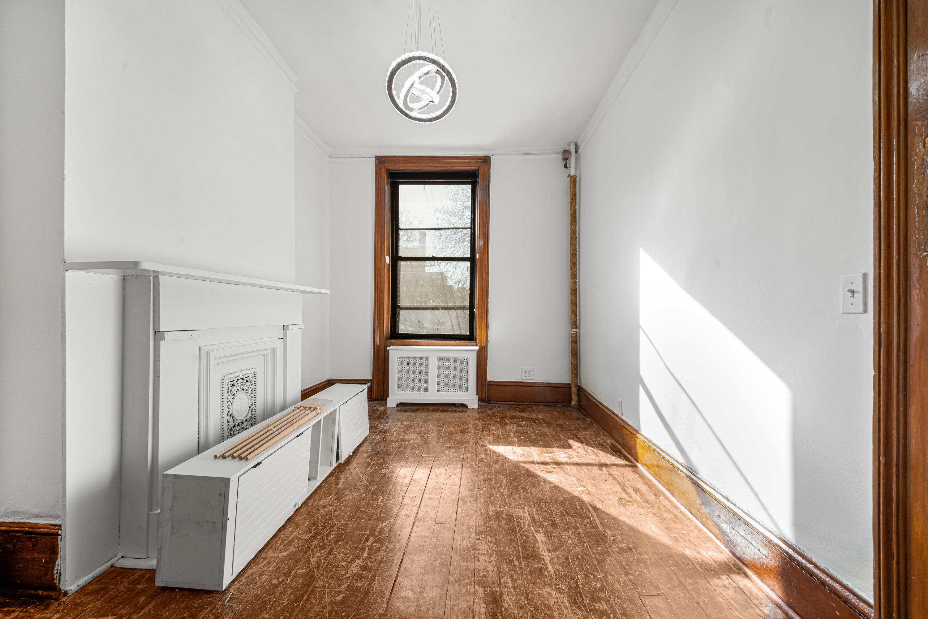 458 West 153rd Street Manhattan, NY 10031 - Photo 9 of 21 a view of a hallway with windows