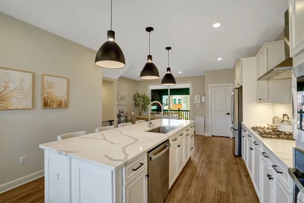 a kitchen with a sink stove and cabinets