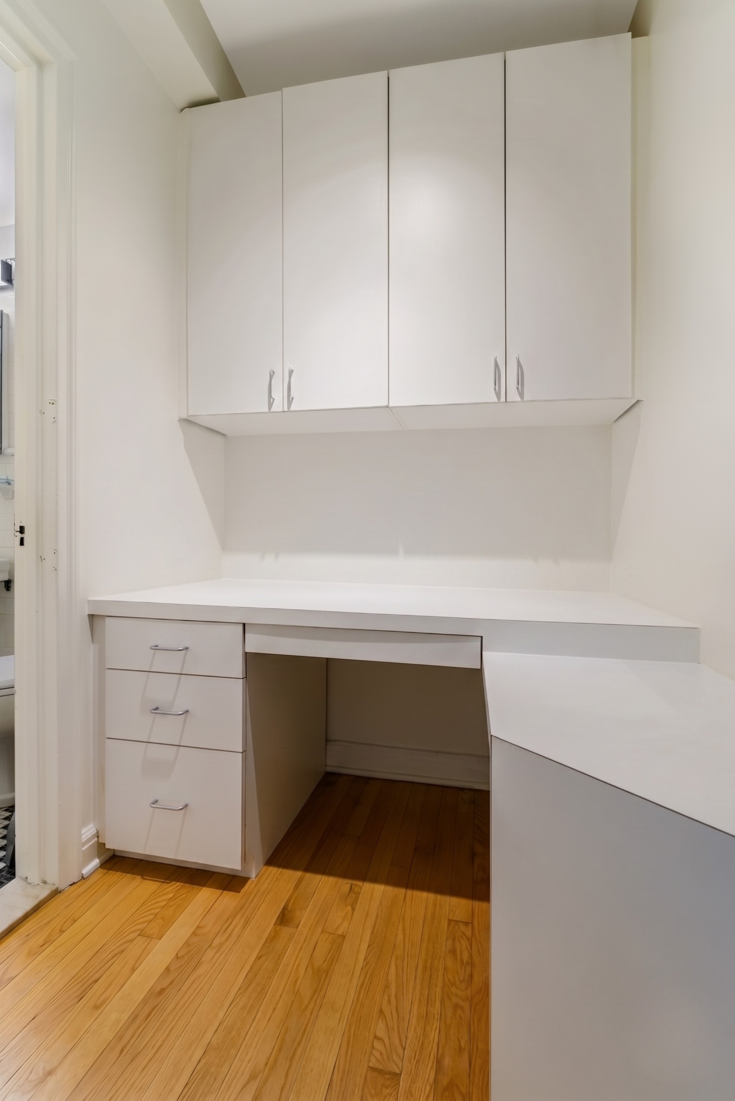 201 West 16th Street, Unit 3C Manhattan, NY 10011 - Photo 7 of 11 a bathroom with a sink and cabinets