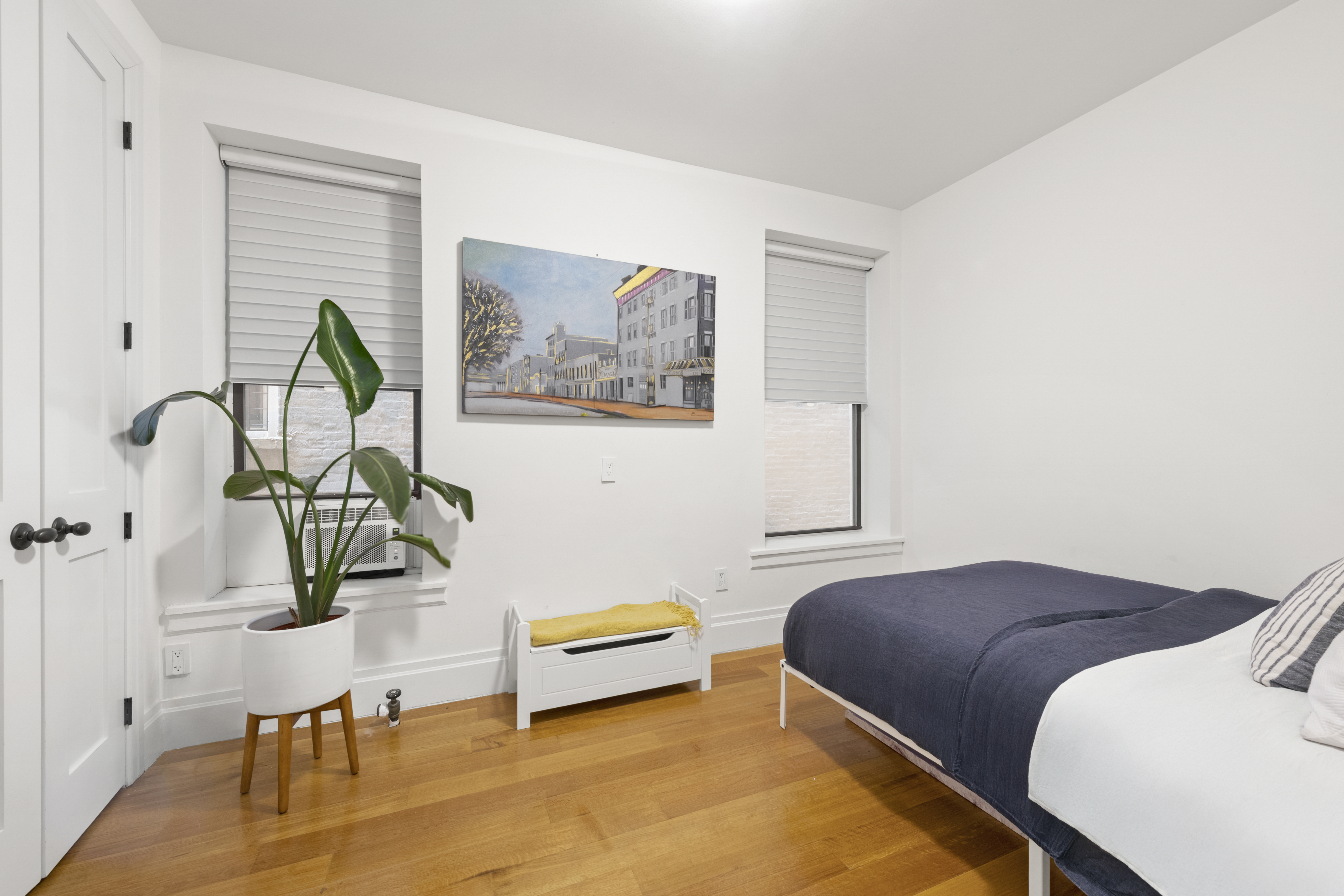 364 West 121st Street, Unit 2A Manhattan, NY 10027 - Photo 10 of 13 a bedroom with a bed and a table