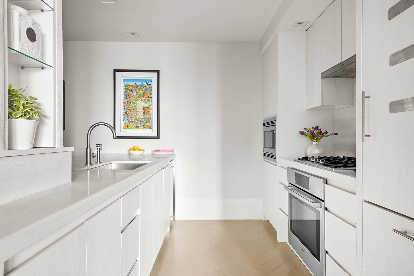 101 Wall Street, Unit 4B Manhattan, NY 10005 - Photo 4 of 20 a kitchen with a sink stove and cabinets