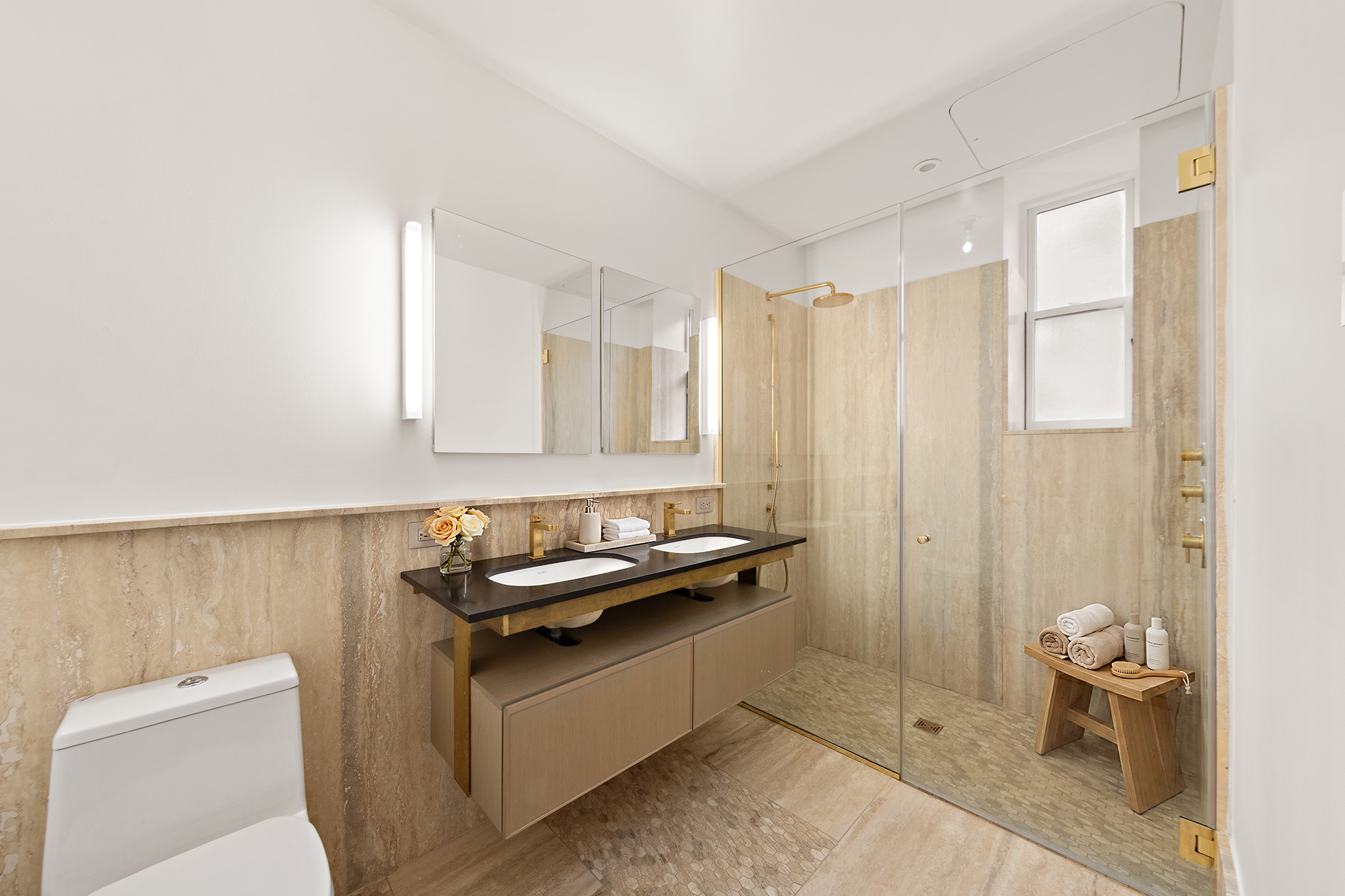 171 Columbia Heights, Unit 3A Brooklyn, NY 11201 - Photo 6 of 7 a bathroom with a granite countertop sink a toilet and a mirror
