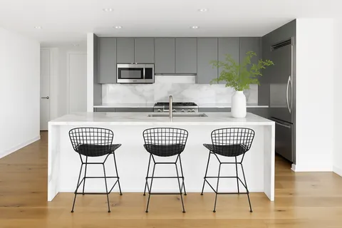 a view of kitchen and dining area with chandelier