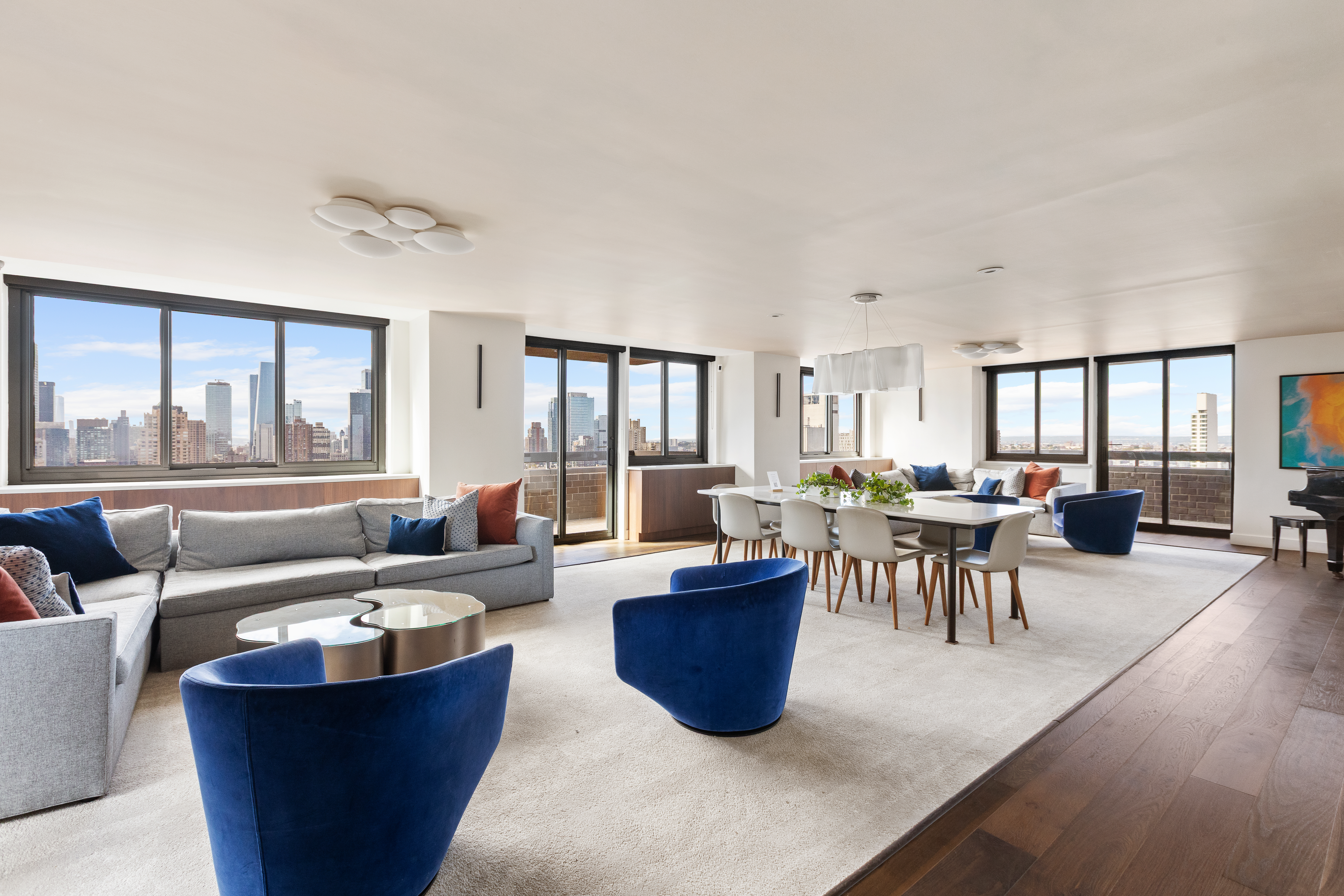 347 West 57th Street, Unit 25AB Manhattan, NY 10019 - Photo 18 of 21 a living room with couch and a large window