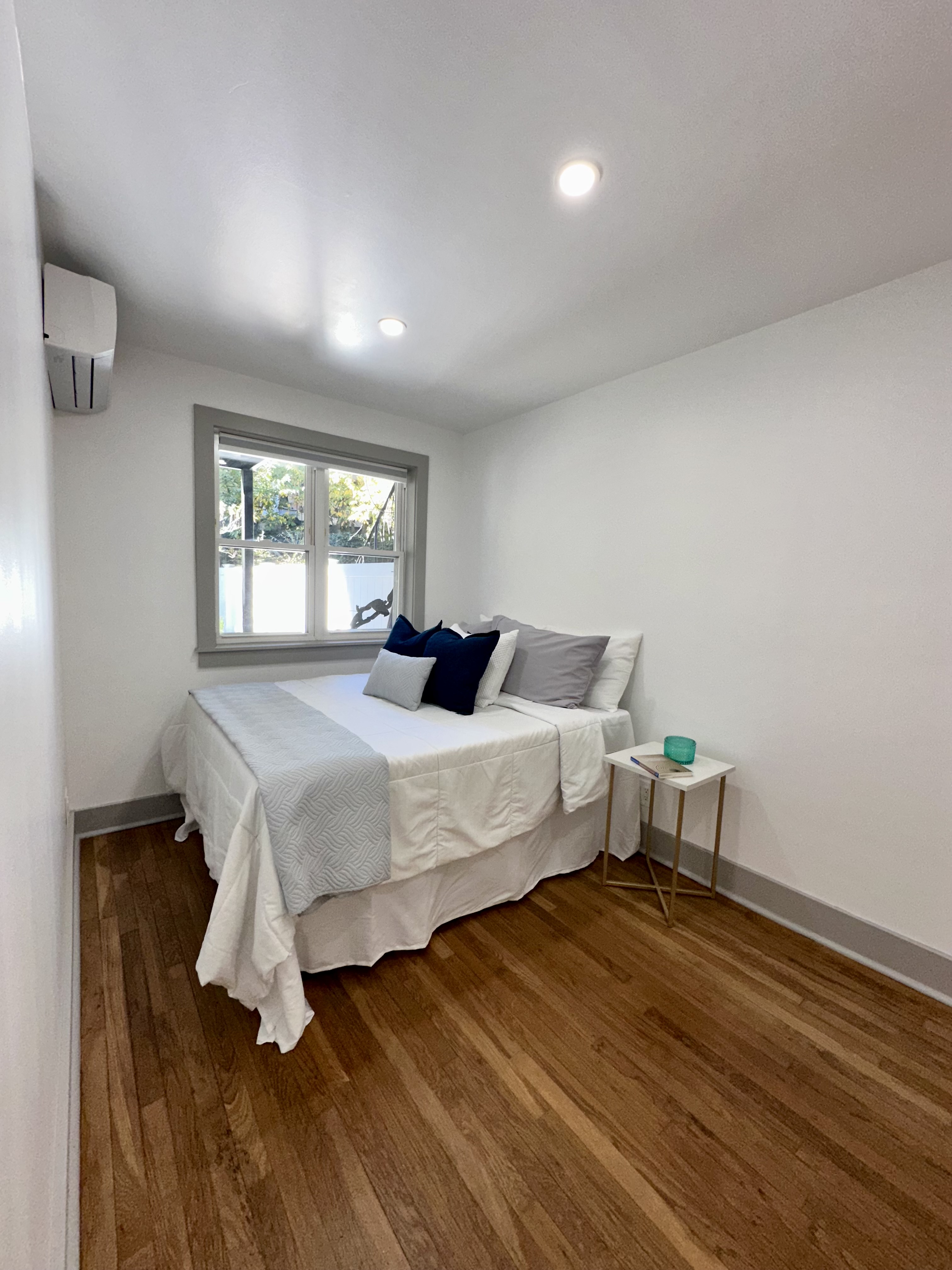 5823 Fieldston Road, Unit 1A Bronx, NY 10471 - Photo 14 of 26 a bedroom with a bed and wooden floor