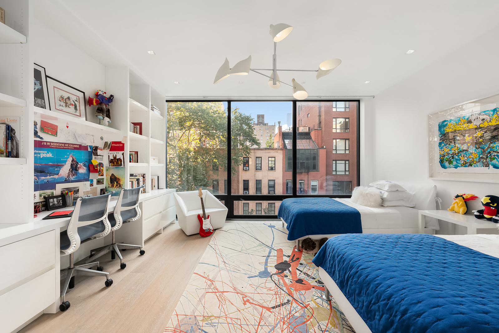184 East 75th Street Manhattan, NY 10021 - Photo 14 of 20 a bedroom with furniture and a large window