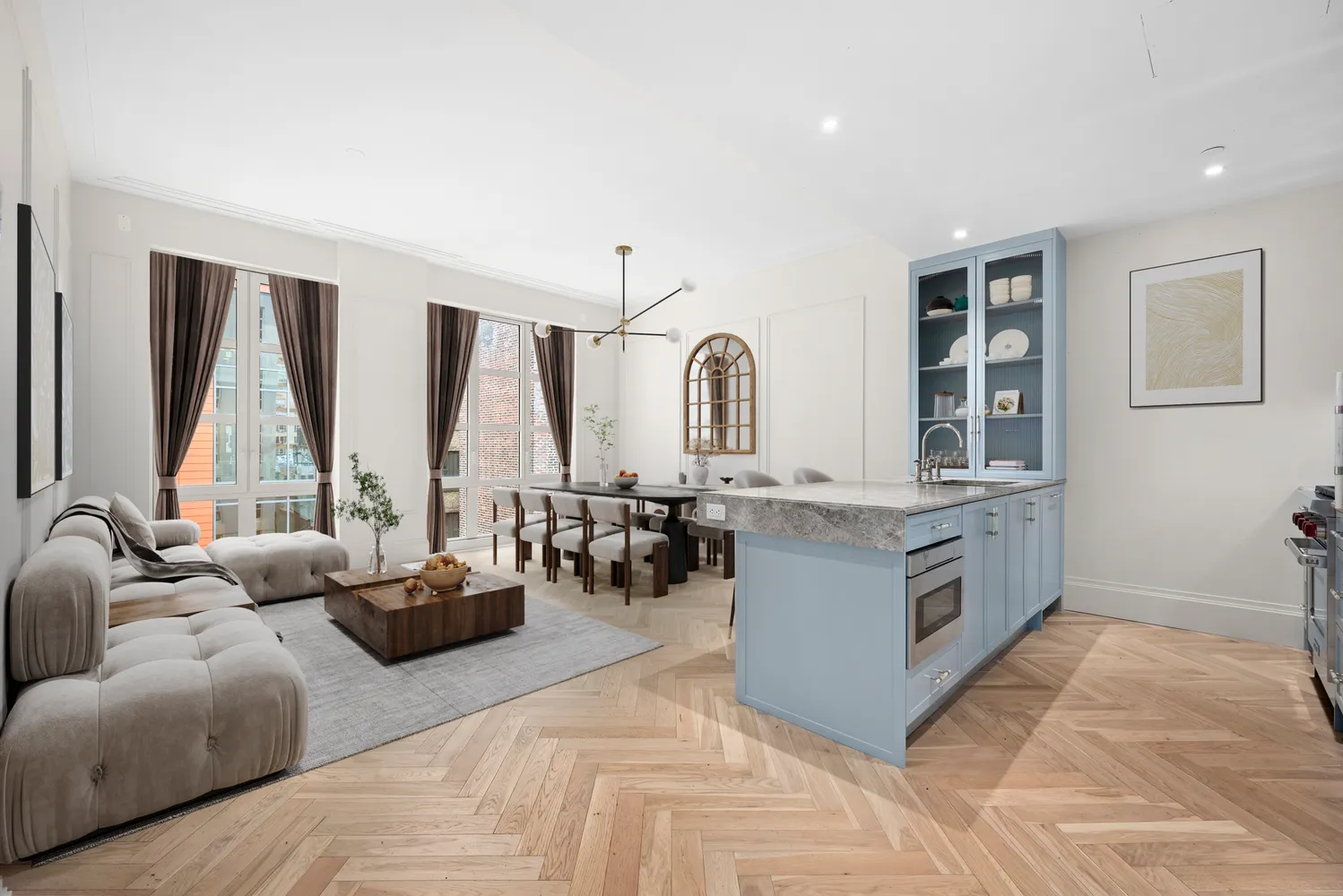 a living room with furniture and large windows
