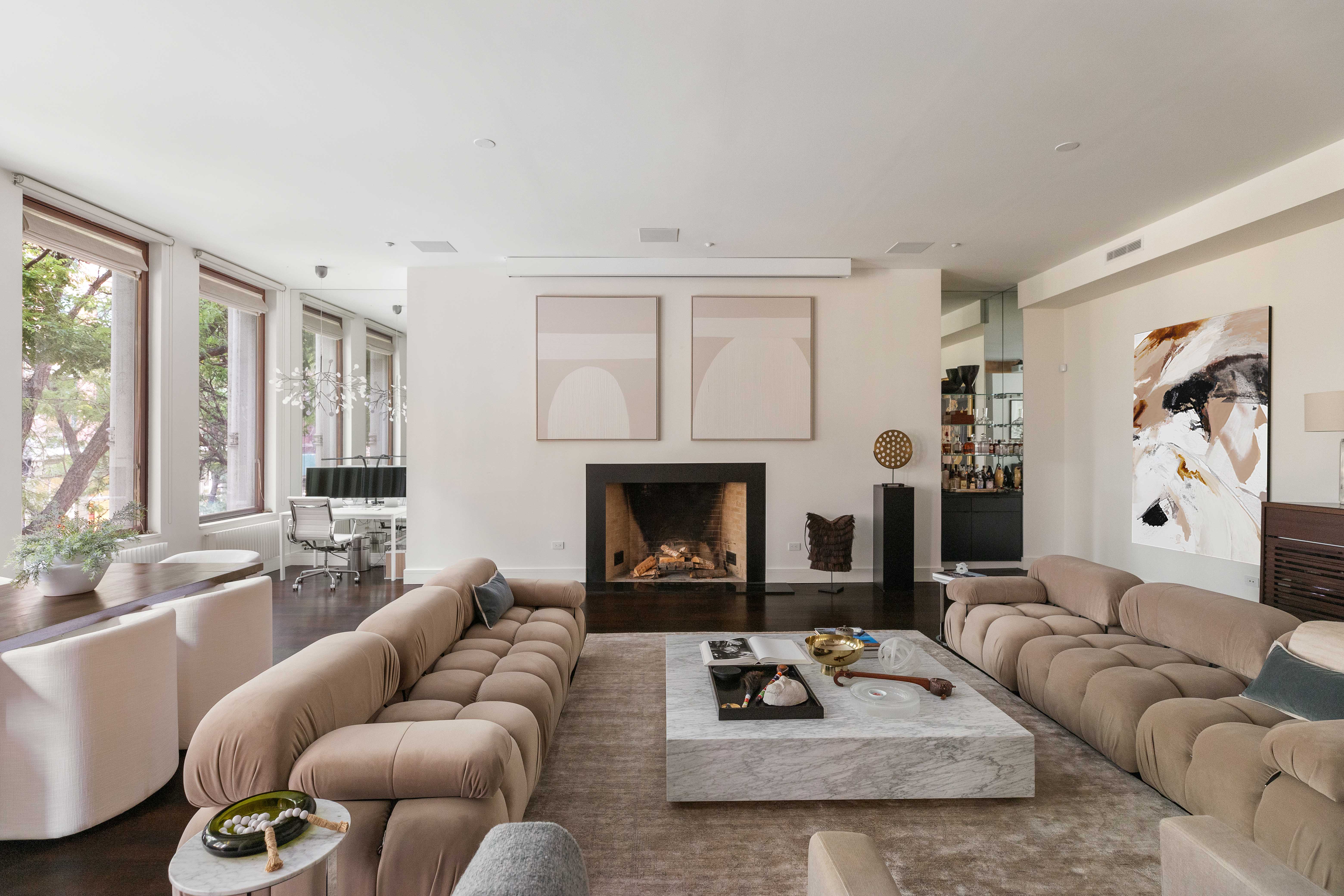 388 West Broadway, Unit 2 Manhattan, NY 10012 - Photo 3 of 27 a living room with furniture and a fireplace