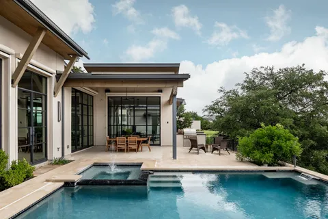 a view of a swimming pool with patio