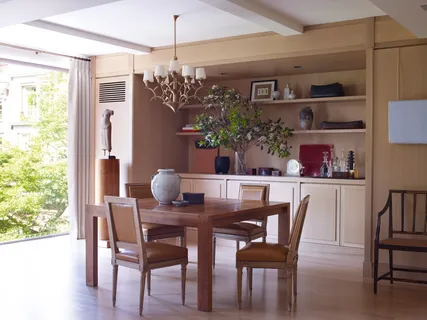 a view of a dining room with furniture and chandelier