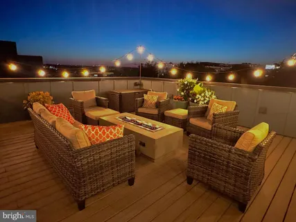 a terrace of a house with outdoor seating