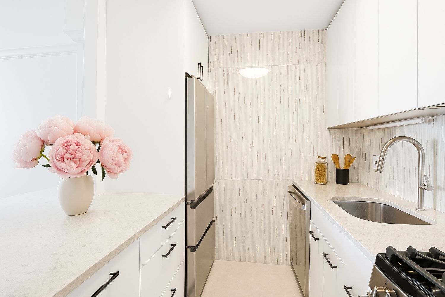 200 East 90th Street, Unit 4F Manhattan, NY 10128 - Photo 2 of 9 a bathroom with a sink a vanity and a mirror
