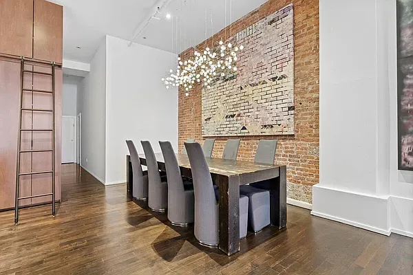 a view of kitchen with furniture and wooden floor