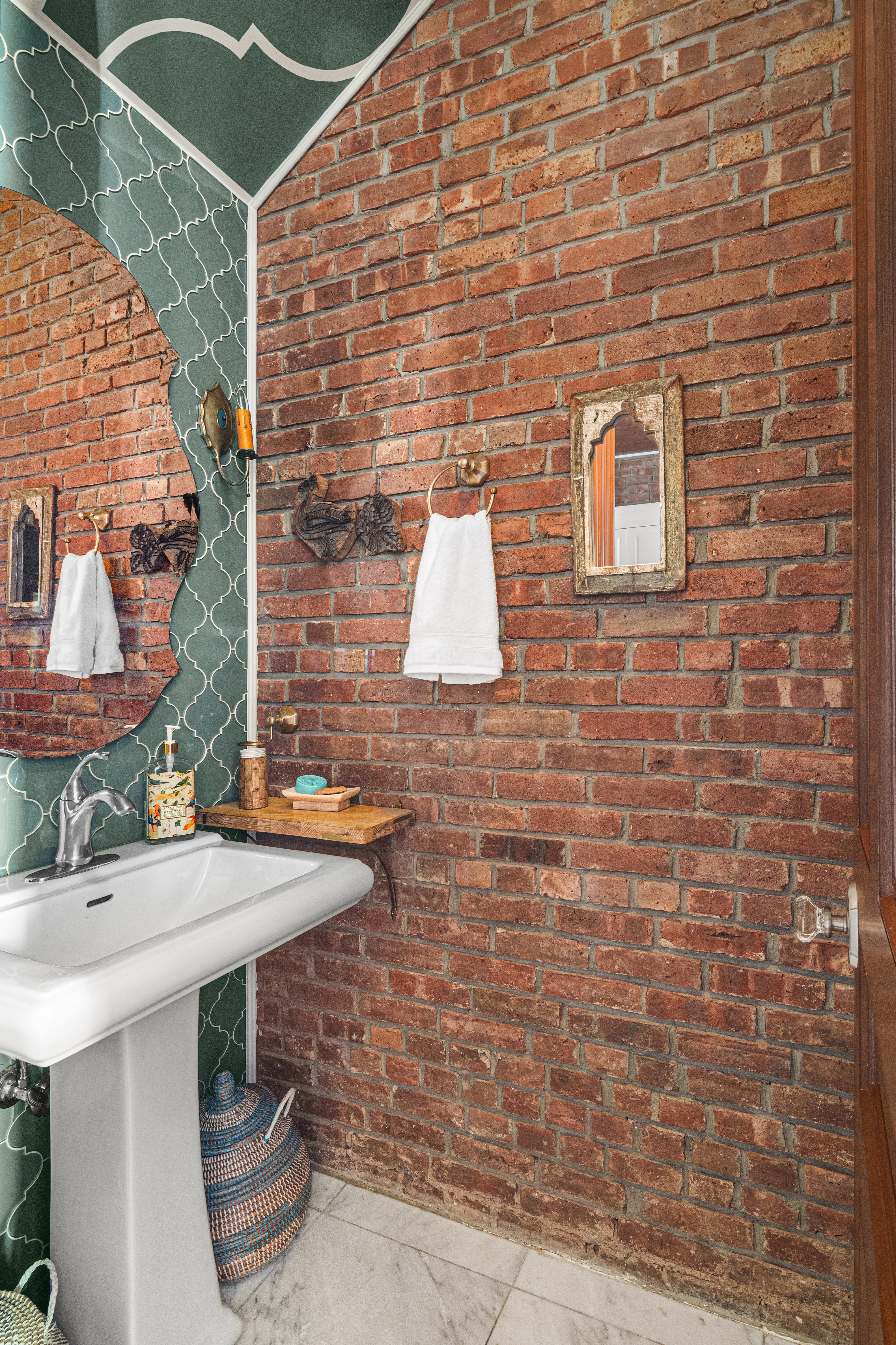 145 West 126th Street, Unit 1 Manhattan, NY 10027 - Photo 15 of 19 a brick building with a sink and potted plants