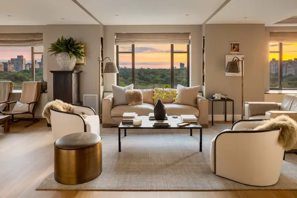 a living room with furniture and a floor to ceiling window