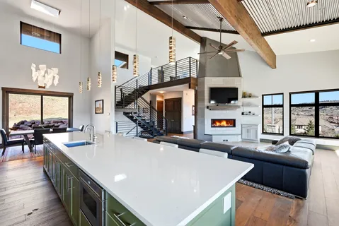 a kitchen with a sink a stove and a window