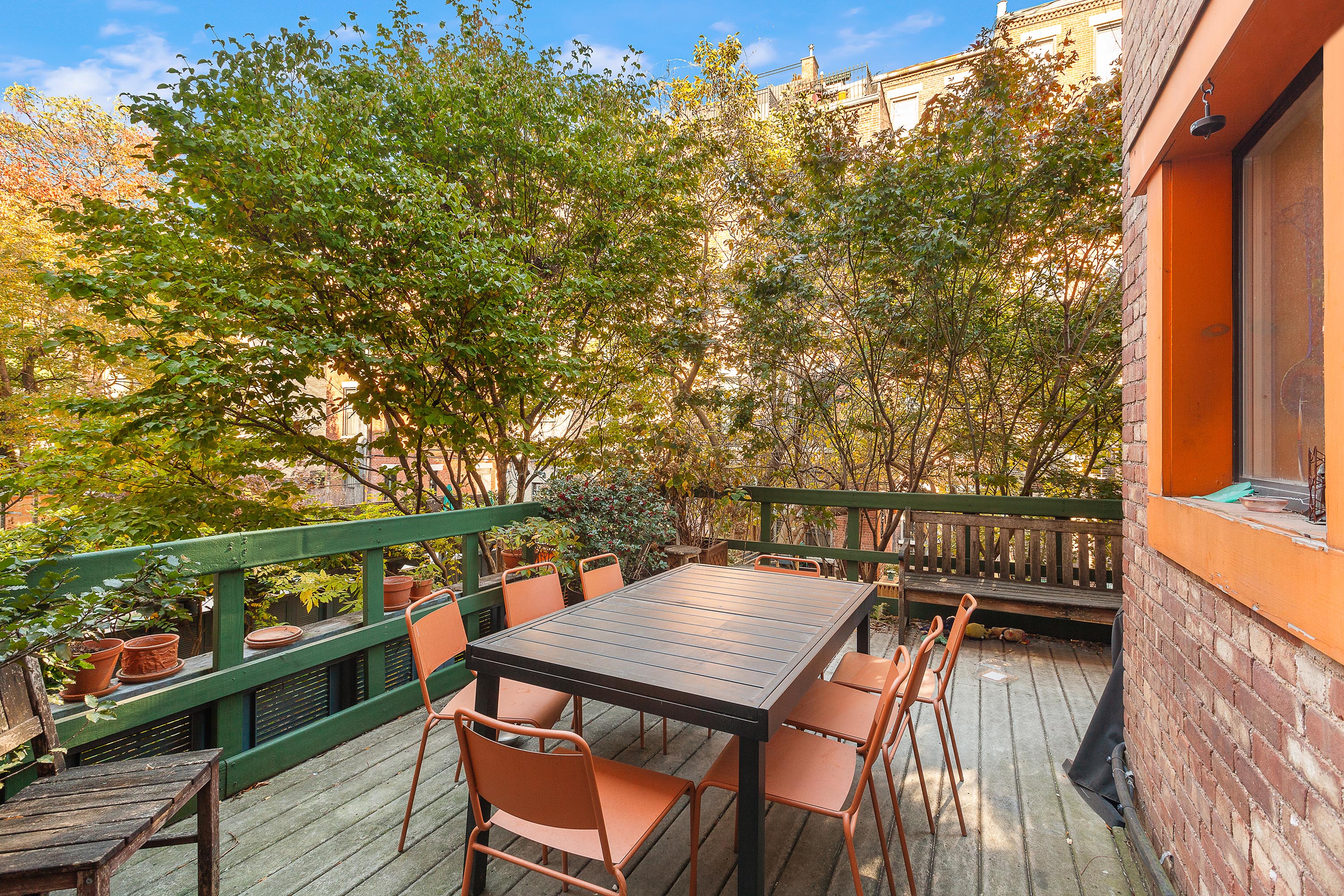 117 West 120th Street Manhattan, NY 10027 - Photo 15 of 31 a balcony with wooden floor and trees