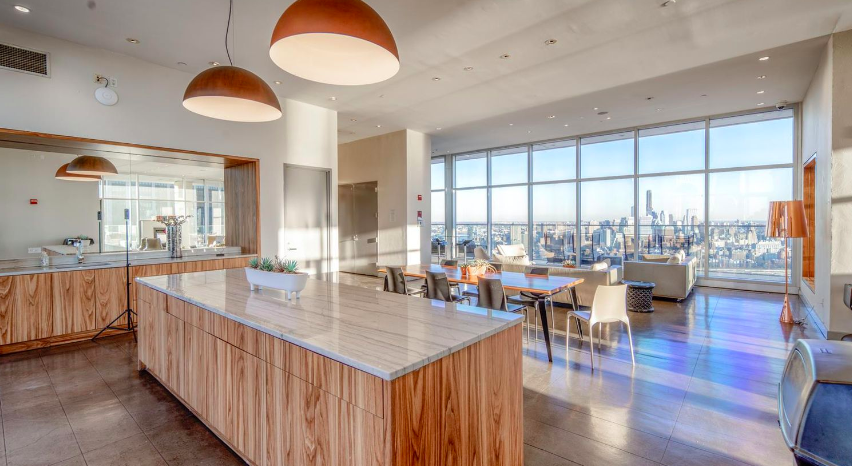 75 Wall Street, Unit 26D Manhattan, NY 10005 - Photo 7 of 11 a dining hall with stainless steel appliances granite countertop a granite counter tops and a large window