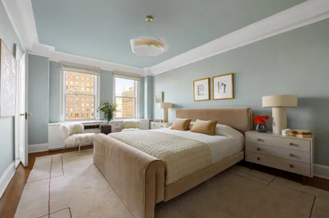 a bedroom with bed and window