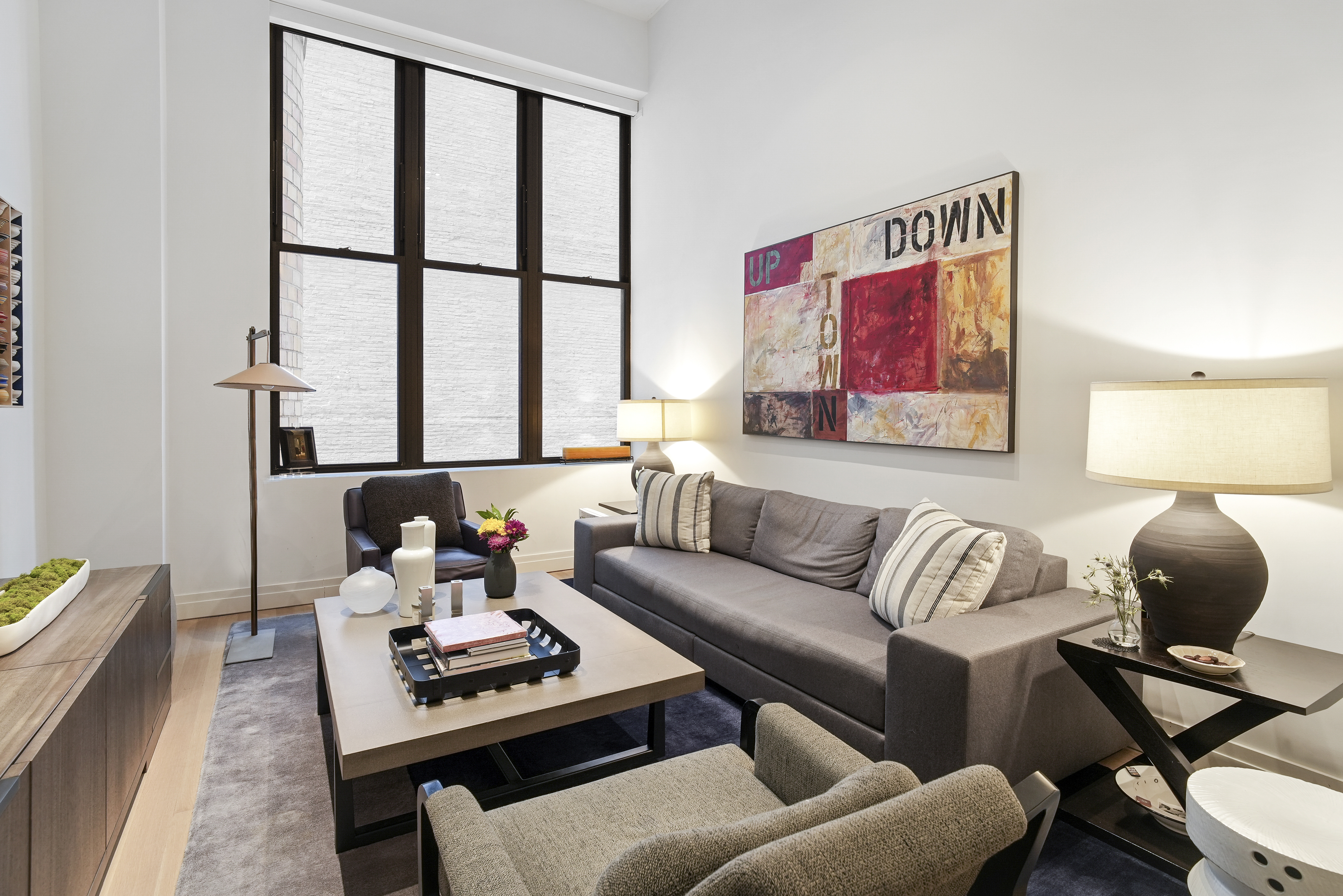 a living room with furniture and a window
