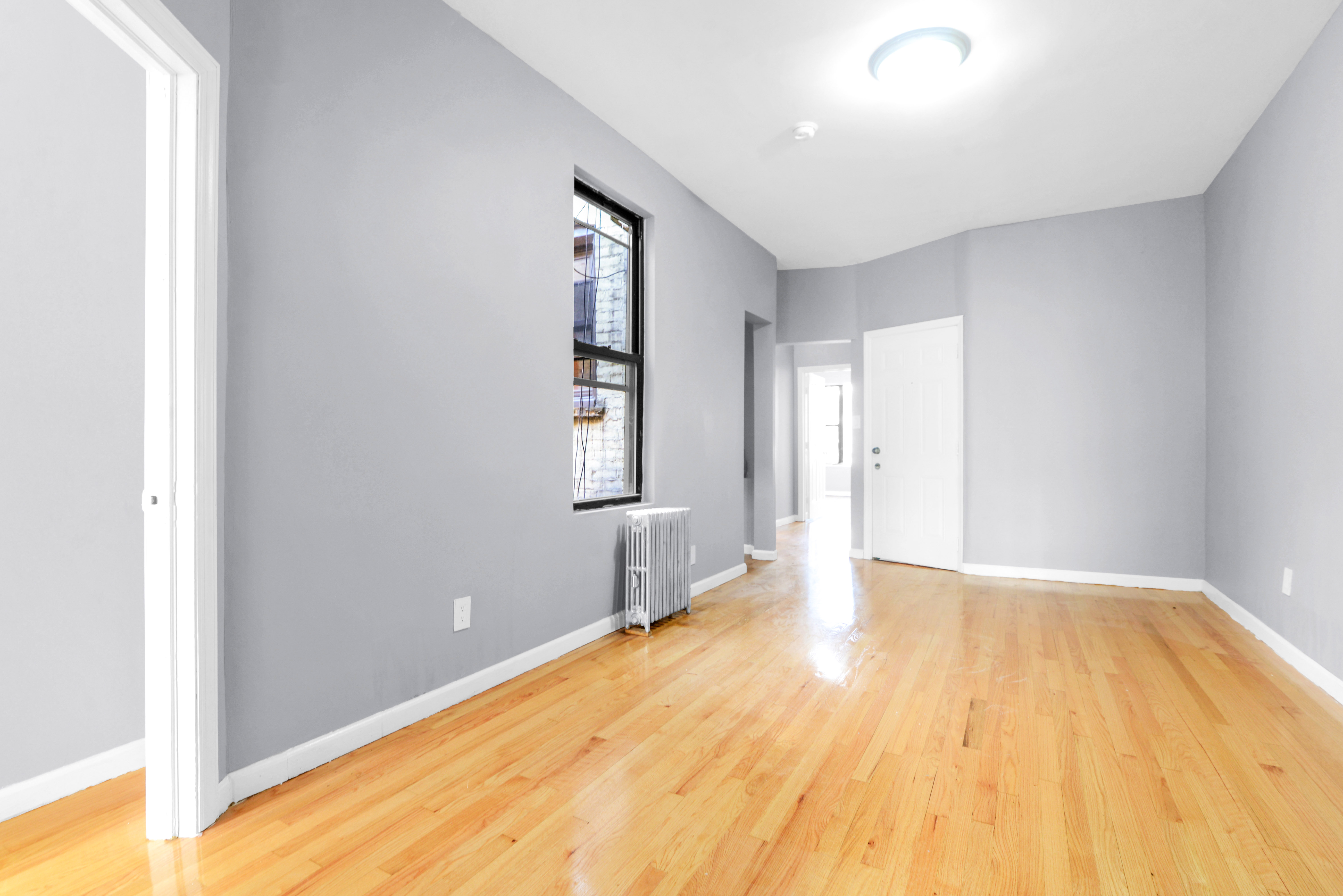 2302 Bedford Avenue, Unit 3 Brooklyn, NY 11226 - Photo 12 of 25 a view of empty room with wooden floor