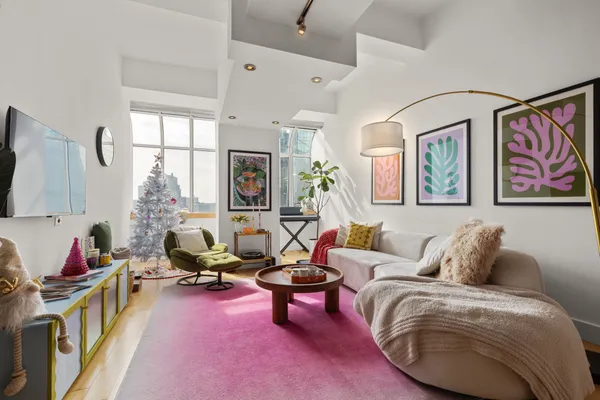 a living room with furniture or couch and a flat screen tv