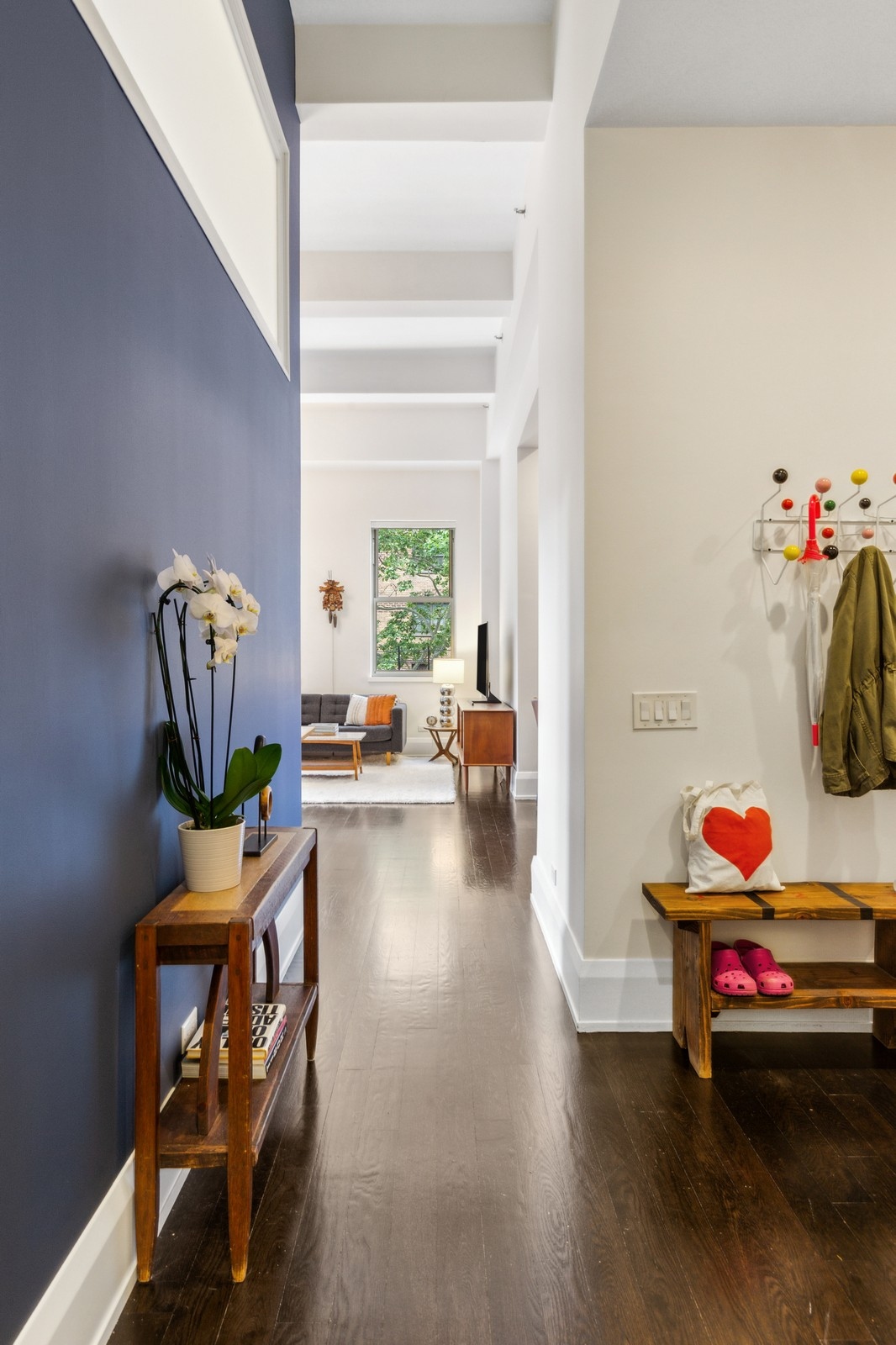263 9th Avenue, Unit 3D Manhattan, NY 10001 - Photo 5 of 15 a living room with furniture and a wooden floor