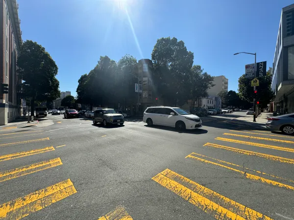 a view of street with parked cars