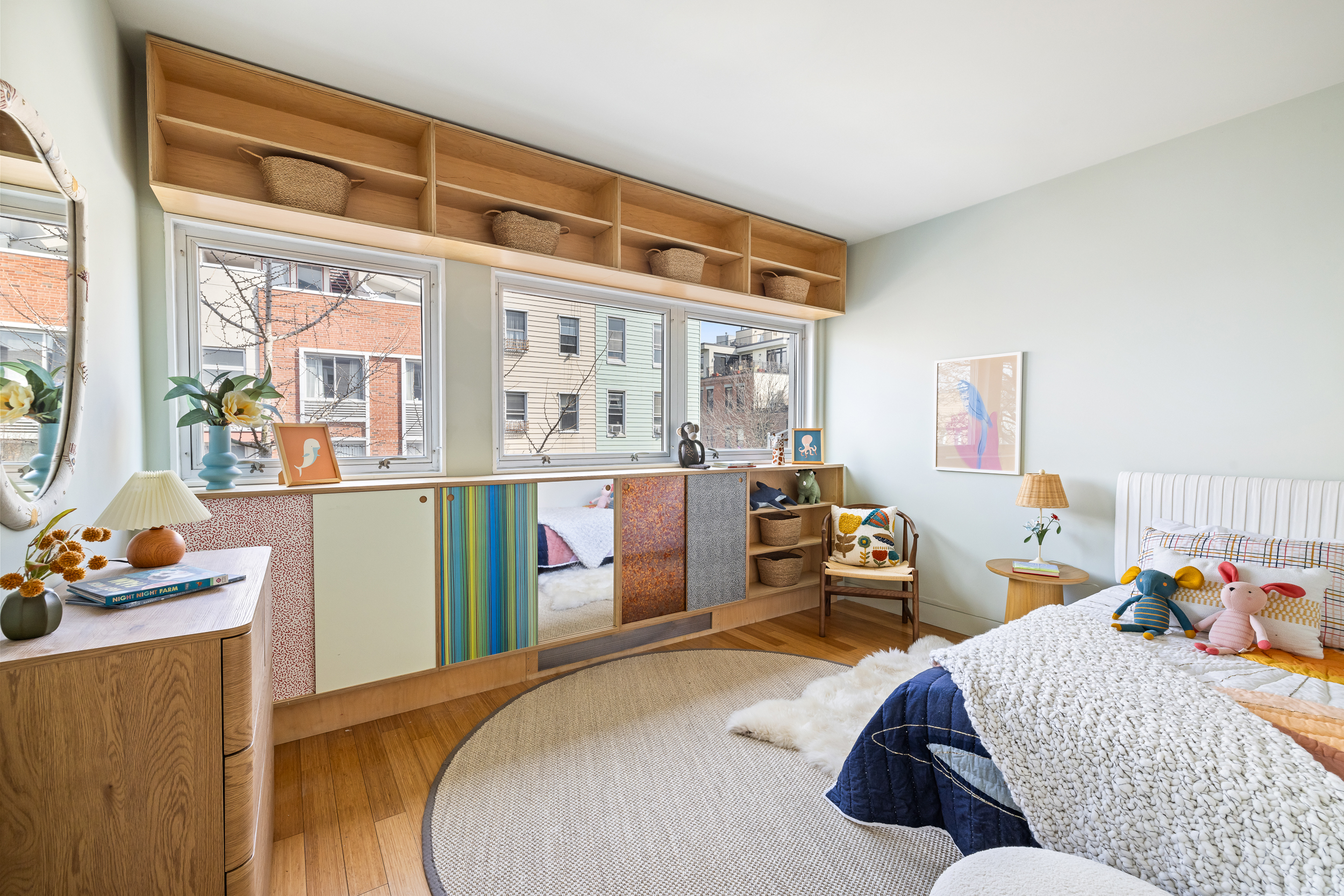 361 Manhattan Avenue, Unit 3AB Brooklyn, NY 11211 - Photo 12 of 21 a bed room with a bed and a window