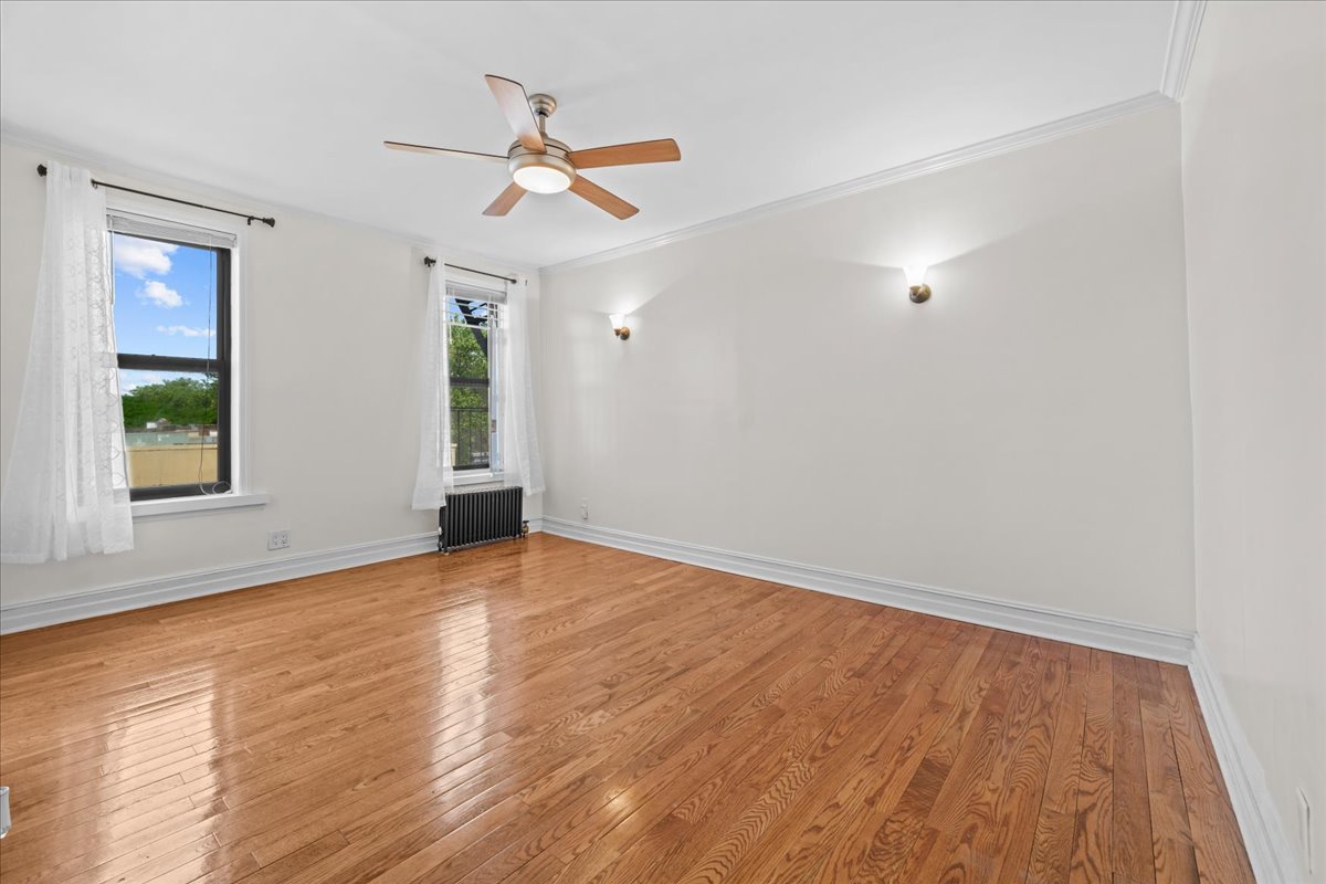 1710 Carroll Street, Unit D4 Brooklyn, NY 11213 - Photo 2 of 16 wooden floor in an empty room with a window