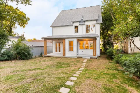 a front view of a house with garden