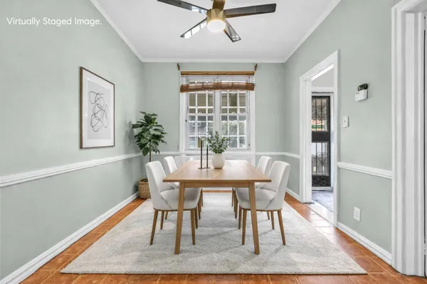 a dining room with furniture and window