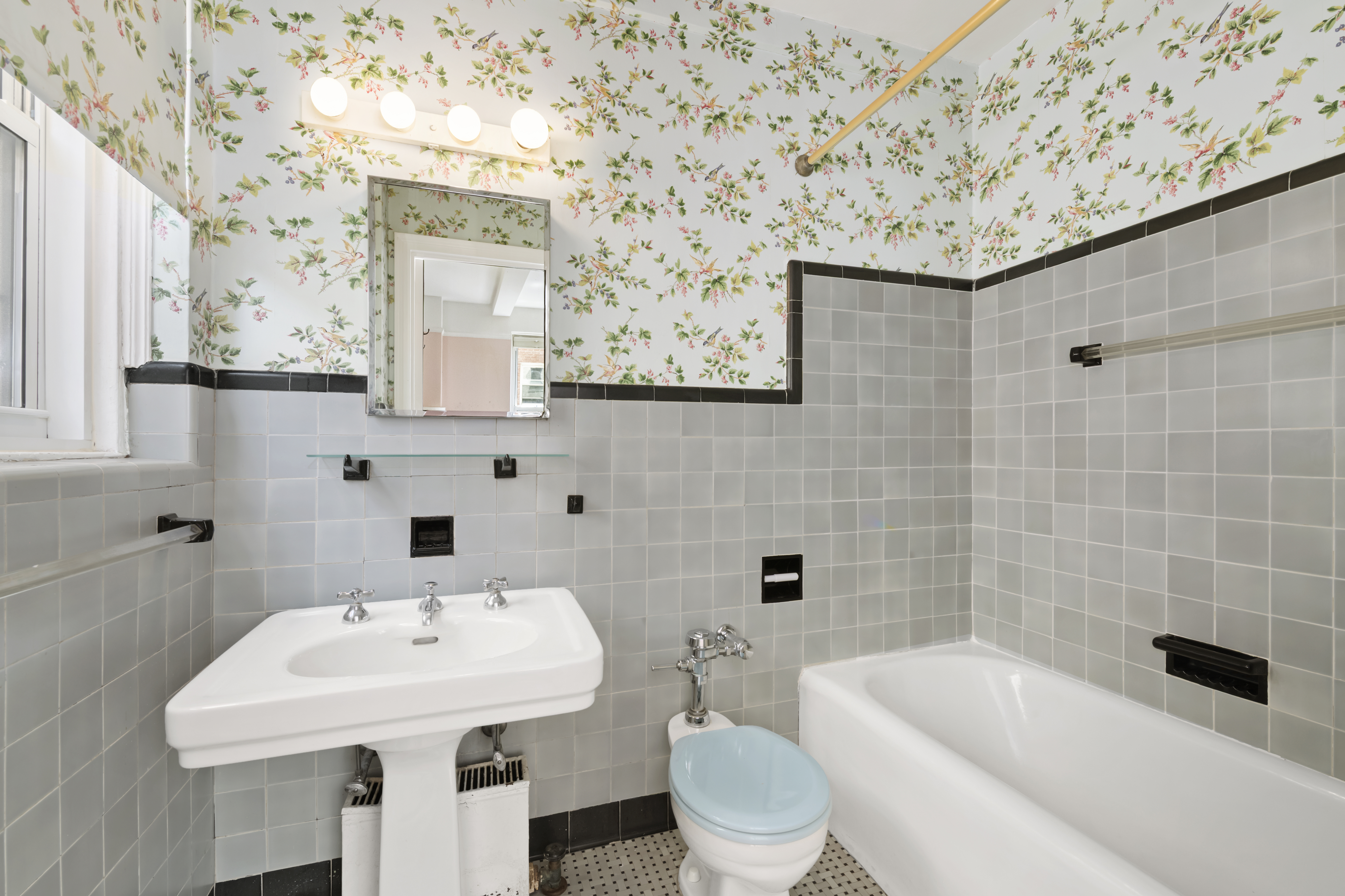 320 East 72nd Street, Unit 6A Manhattan, NY 10021 - Photo 11 of 13 a bathroom with a sink a toilet and shower