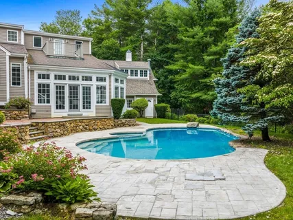 a view of a house with swimming pool
